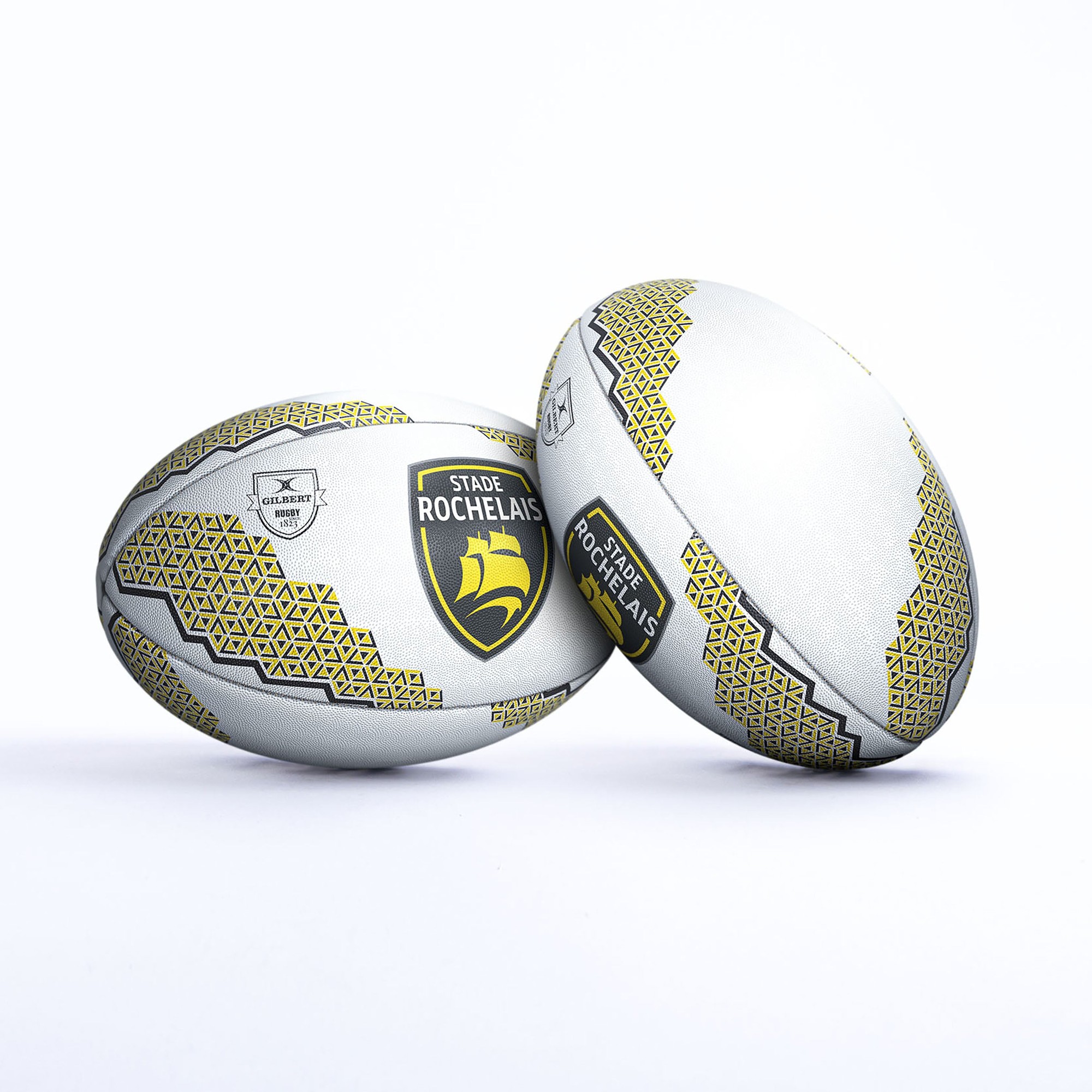 White rugby ball featuring yellow and black La Rochelle logo, geometric patterns, and textured surface for grip, designed for supporters of Gilbert Rugby.