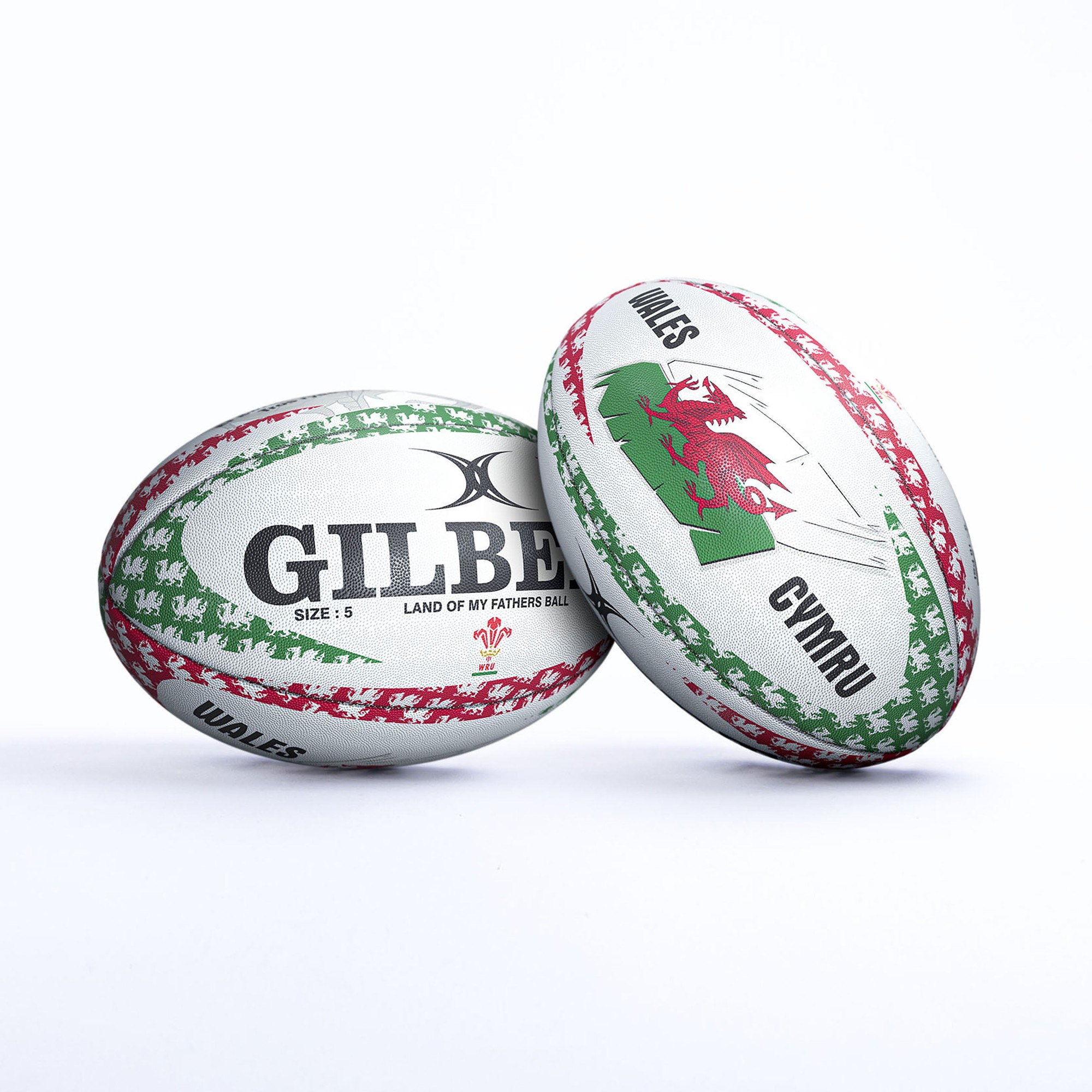 Gilbert Rugby Land of My Fathers mascot ball featuring a white surface with red and green accents, displaying the Welsh dragon and "Wales" text, made from durable synthetic material.