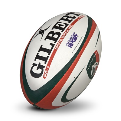 Gilbert Leicester Tigers replica rugby ball in white, green, and red, featuring the Gilbert logo, "Official Replica Ball," and "Size 5" text.