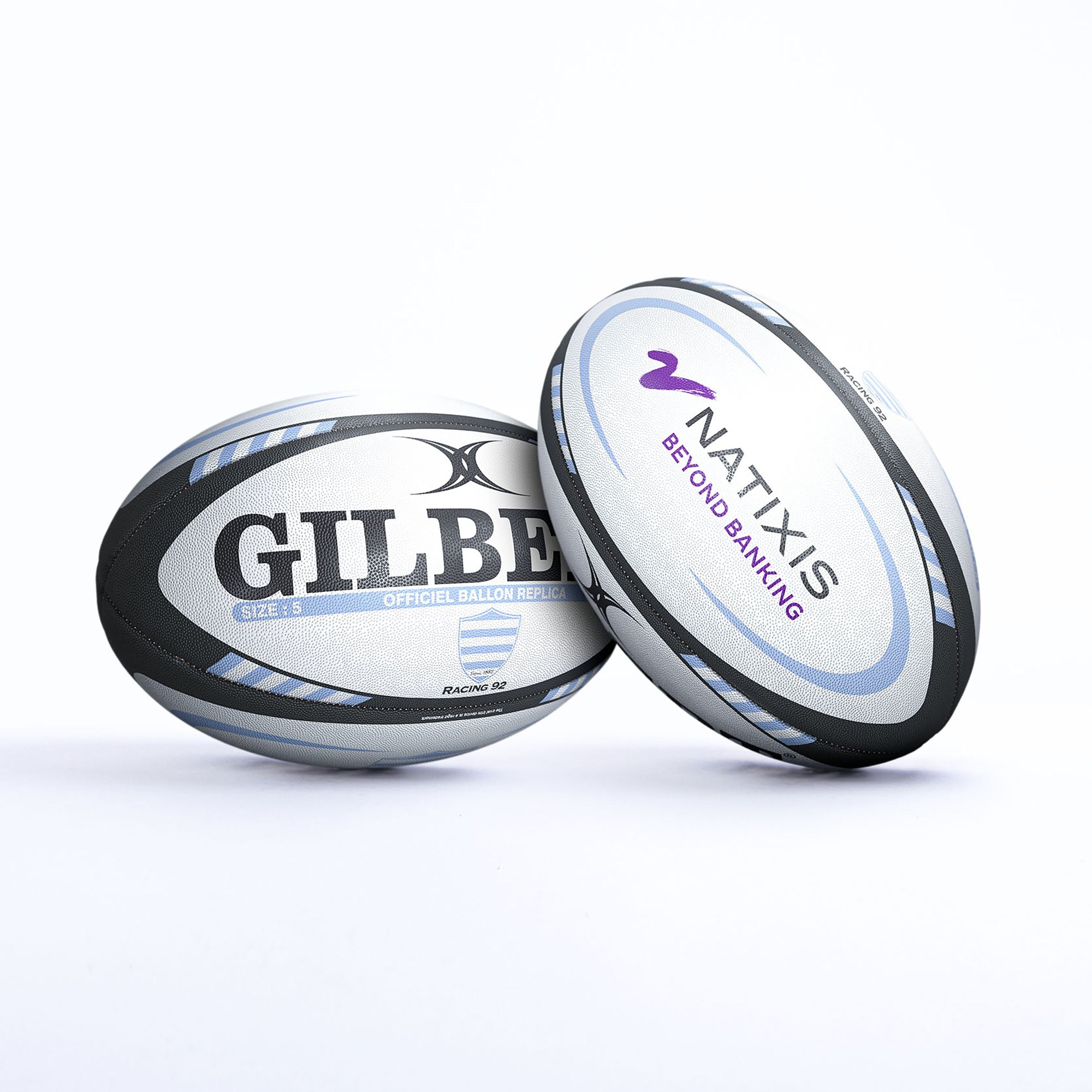Gilbert Metro Racing 92 replica rugby ball featuring a silver and black design with "GILBERT" and "NATIXIS" logos, made of durable synthetic material, size 5.