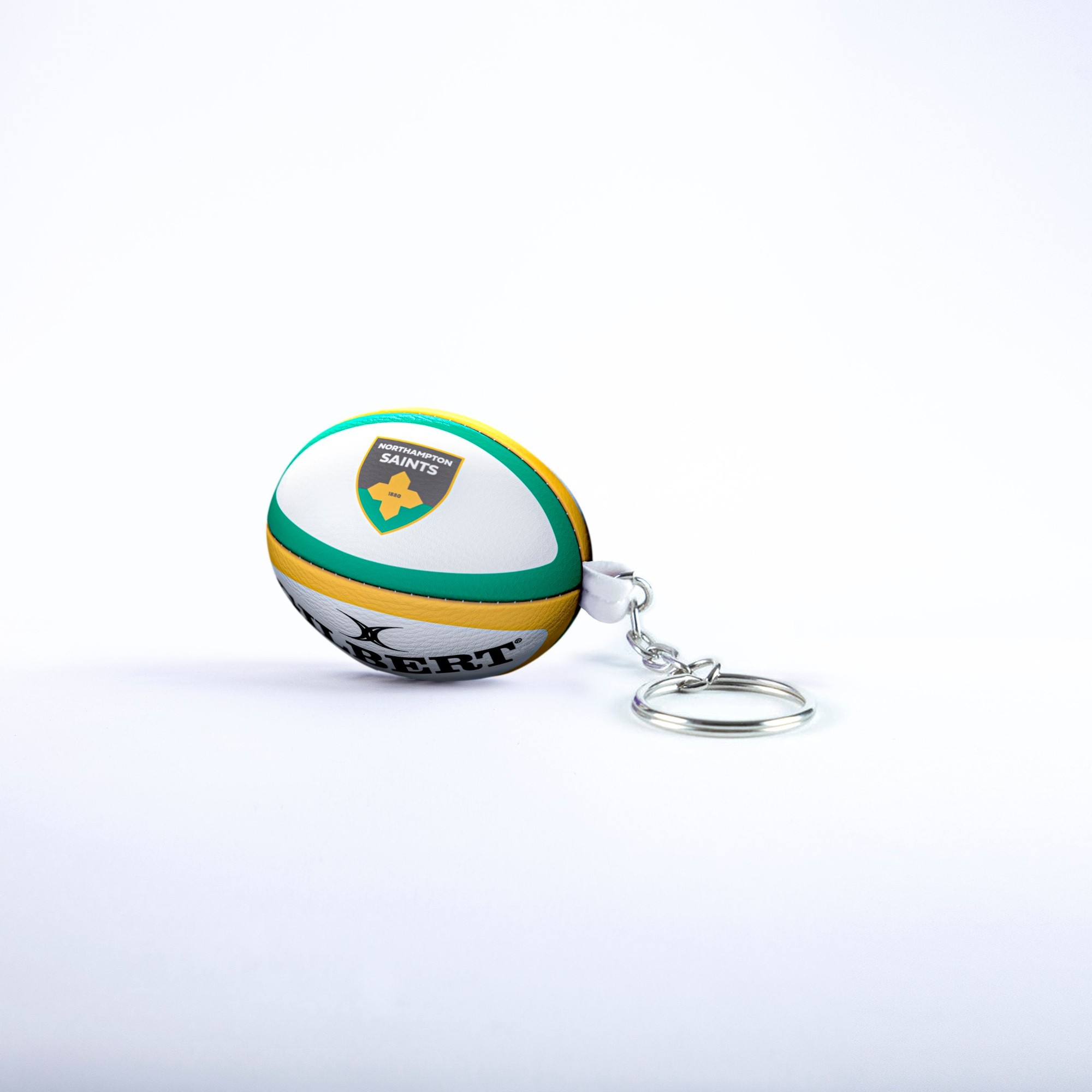 Green, yellow, and white rubber rugby ball keyring featuring the Northampton Saints logo and a silver keychain attachment.