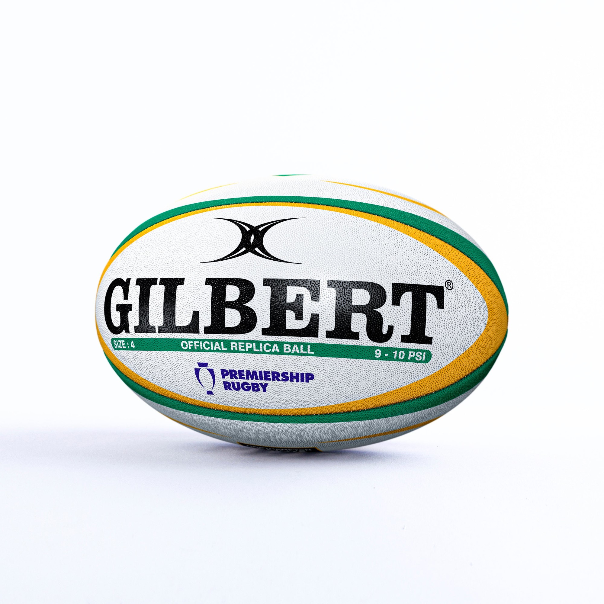 White rugby ball with green and yellow accents, featuring "GILBERT" in bold black letters and "OFFICIAL REPLICA BALL" text, designed for the Northampton Saints and marked with Premiership Rugby logo.