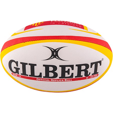 White rugby stress ball with red and yellow accents, featuring the "GILBERT" logo prominently on one side and "OFFICIAL REPLICA BALL" text, designed for squeezing and stress relief.