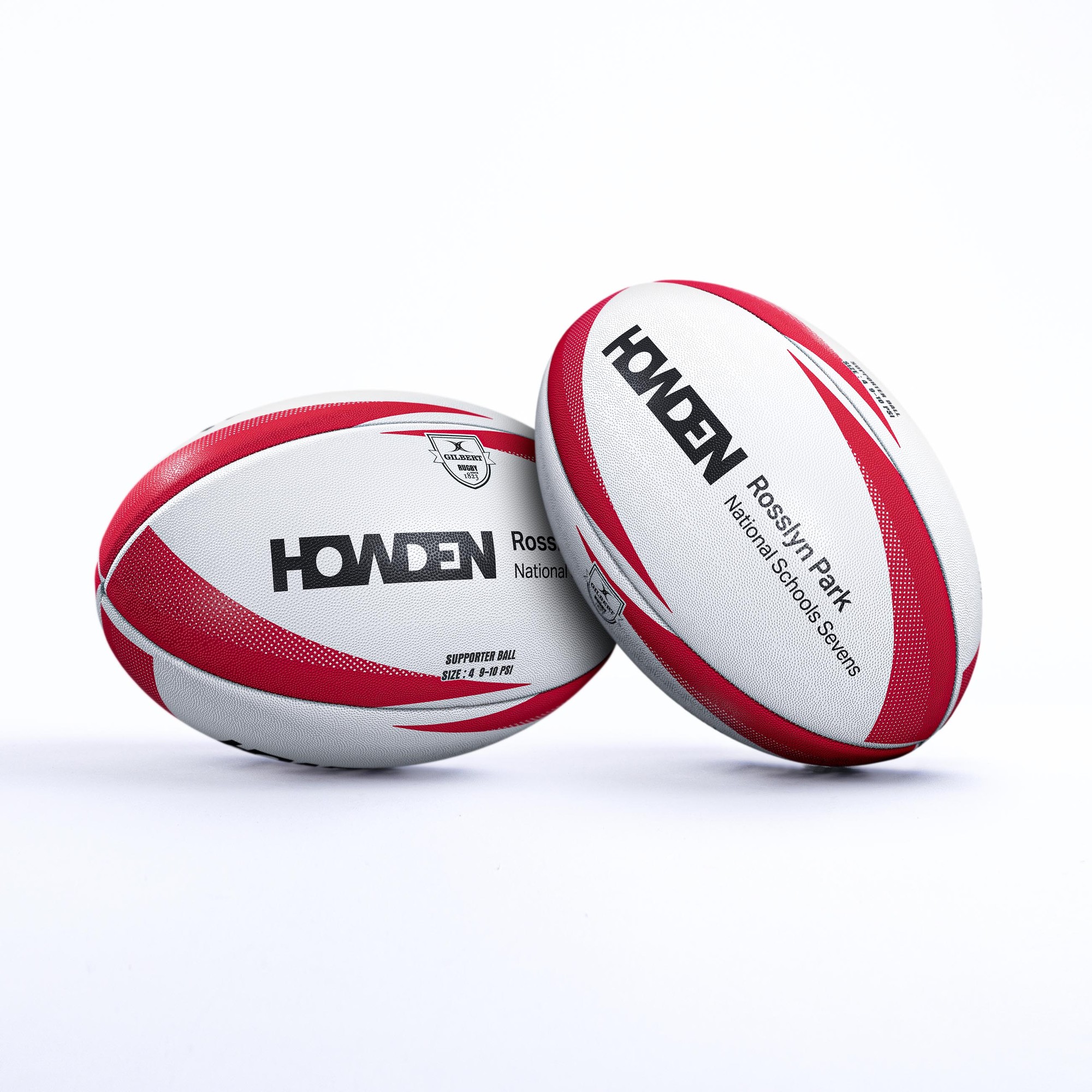 White rugby ball with red accents, featuring "Gilbert Rosslyn Park National Schools 7s 2026" branding and a textured surface for grip.