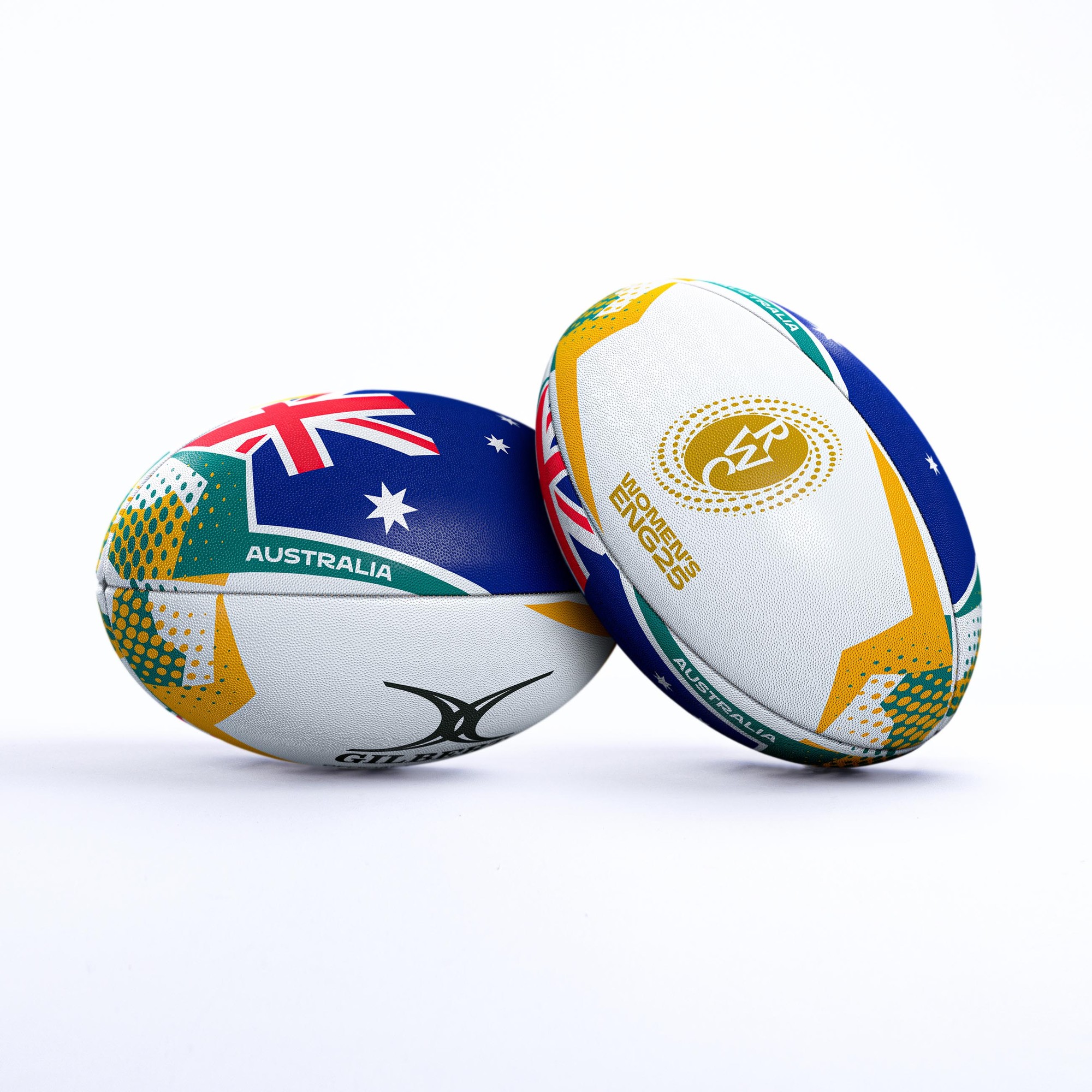 Two rugby balls featuring the Australian flag, one predominantly blue with green and gold accents, and the other white with blue and gold details, marked for the RWC 2025.