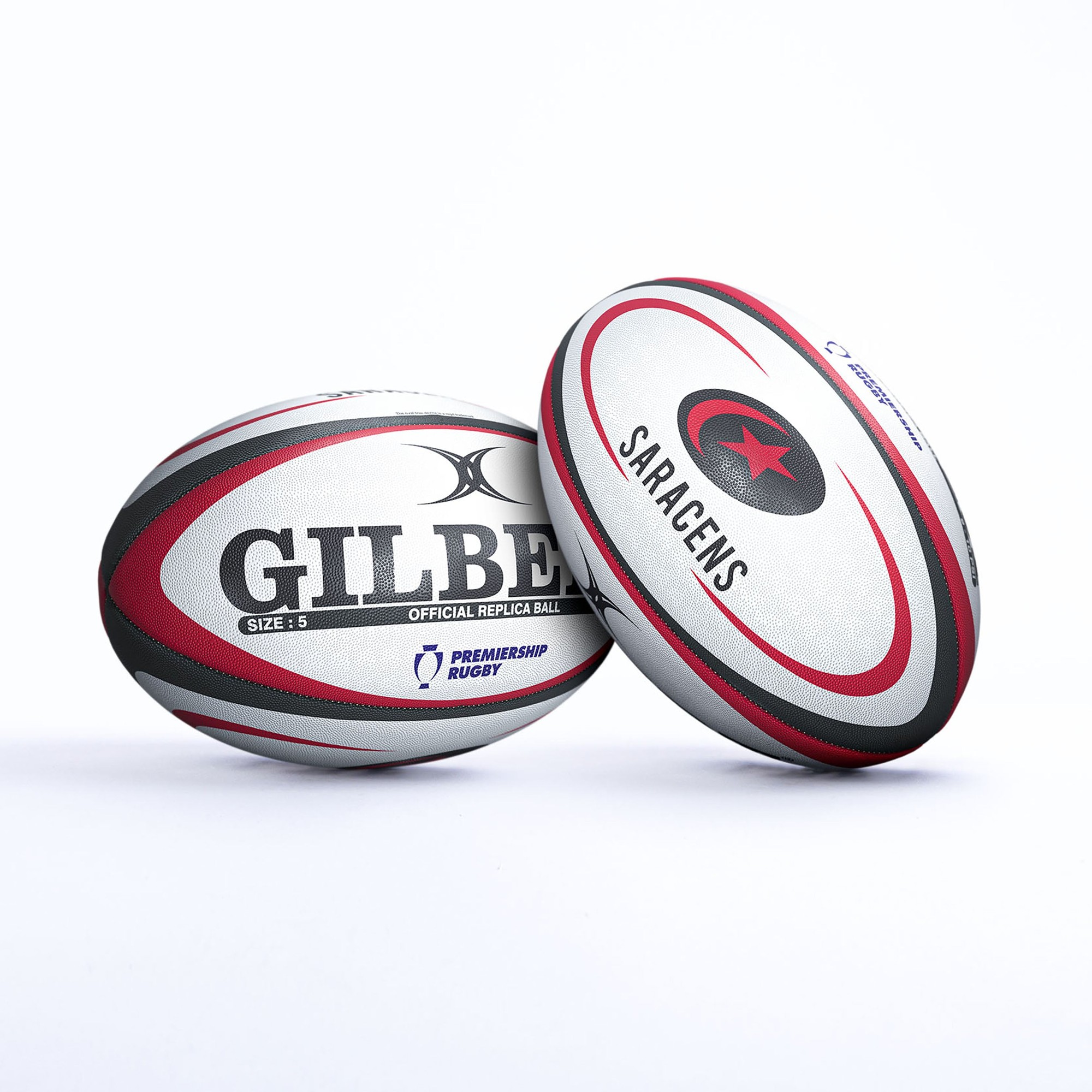 Gilbert Saracens replica rugby ball featuring a white and red design, with "GILBERT" and "SARACENS" printed prominently, made of durable synthetic material.