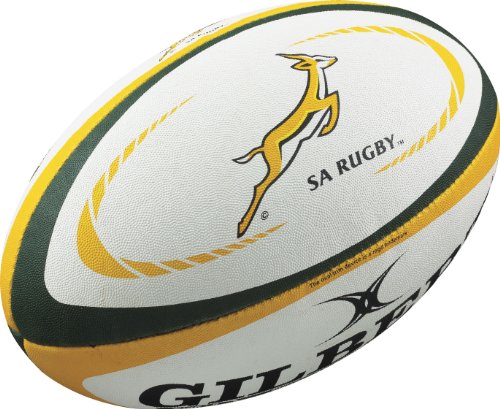 South Africa replica rugby ball in white with green and yellow accents, featuring a springbok logo and "Gilbert" branding, made from textured synthetic material.