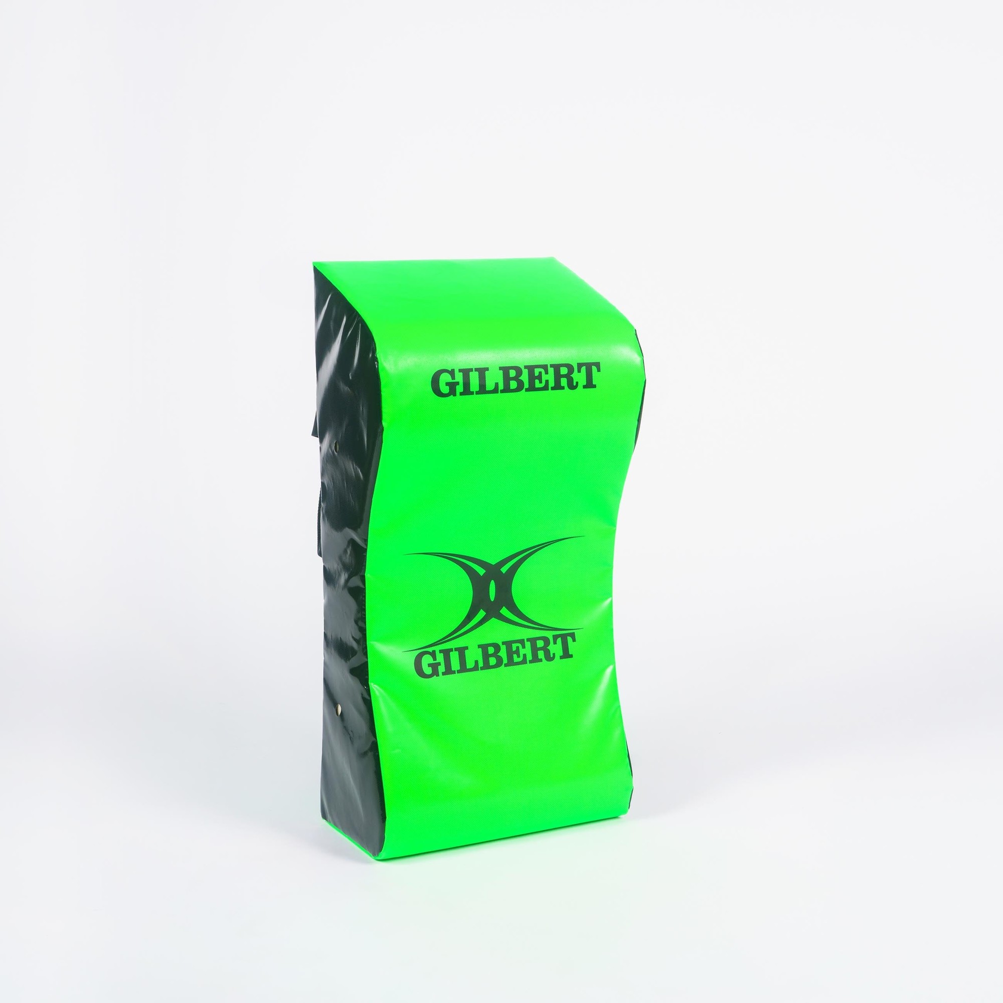 Bright green tackle wedge with black sides, featuring the "GILBERT" logo prominently displayed on both sides, designed for junior rugby training.