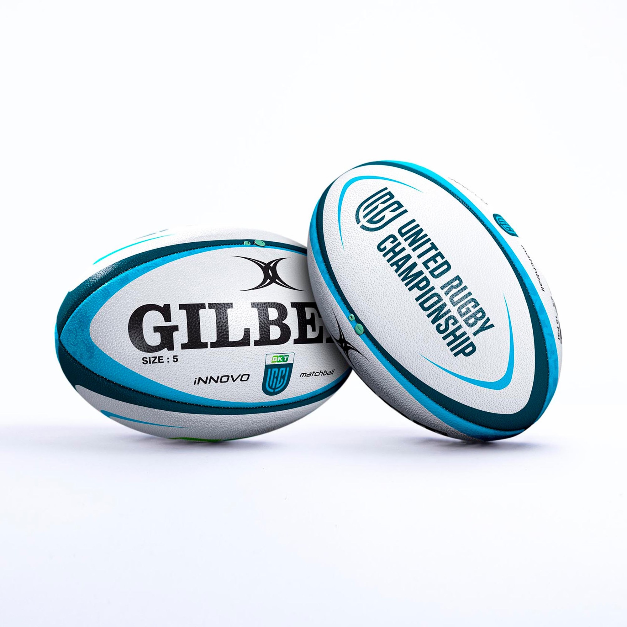 Two Gilbert URC BKT Innovo Match Balls, featuring a white and teal design, with "GILBERT" and "UNITED RUGBY CHAMPIONSHIP" logos, made of durable synthetic material, size 5.