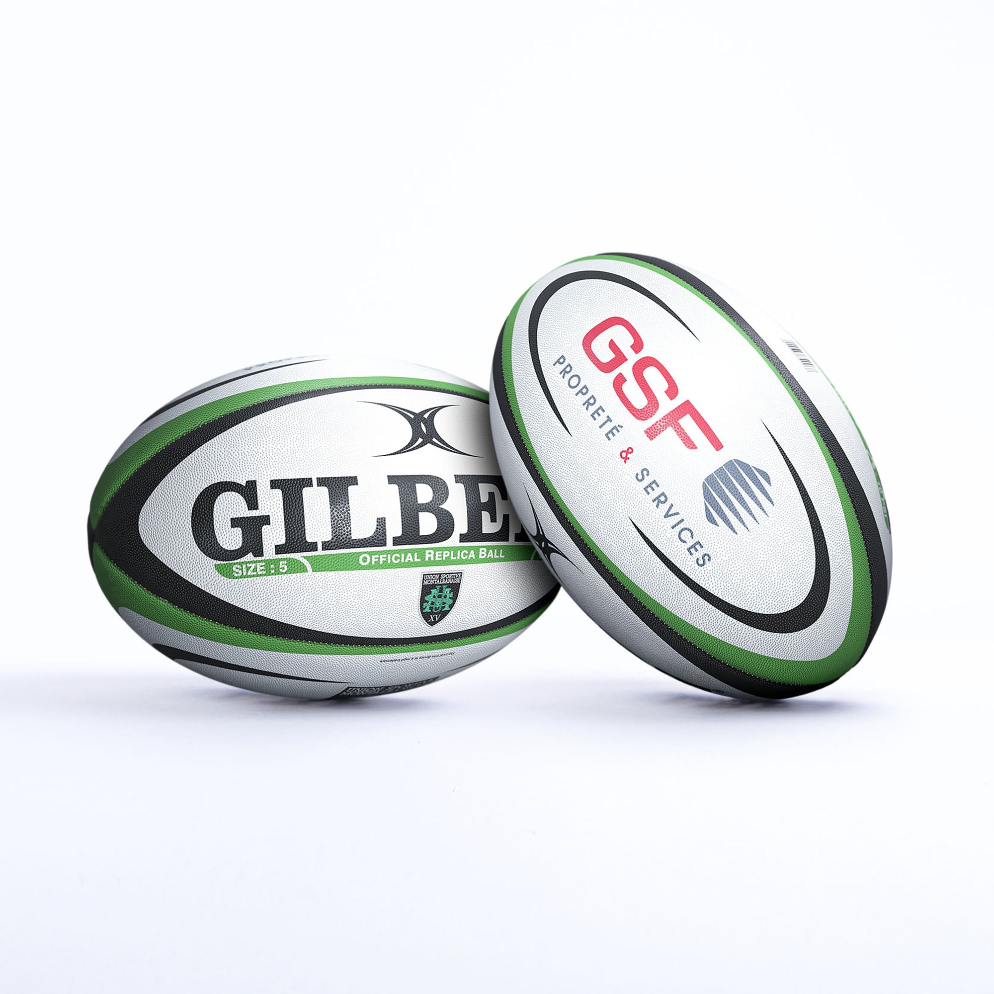 Gilbert USM Montauban replica rugby ball featuring a white body with green and black accents, displaying "GILBERT" and "OFFICIAL REPLICA BALL" text.