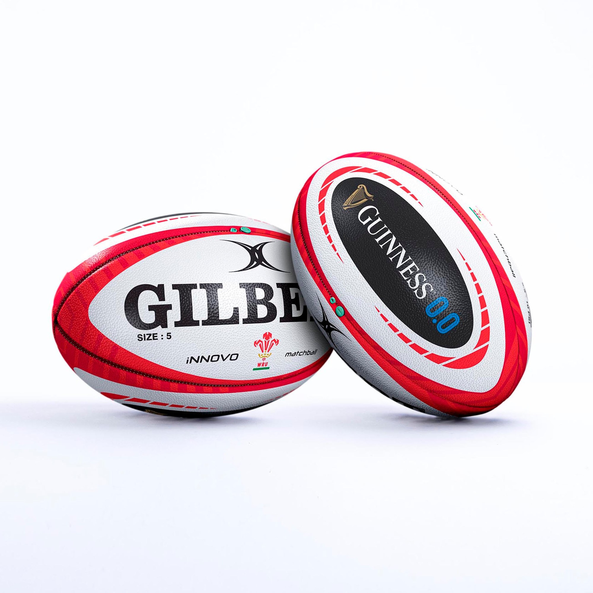 White rugby ball with red and black accents, featuring "GILBERT" and "GUINNESS" logos, marked as size 5 and "INNOVO," designed for the Wales Guinness Six Nations.