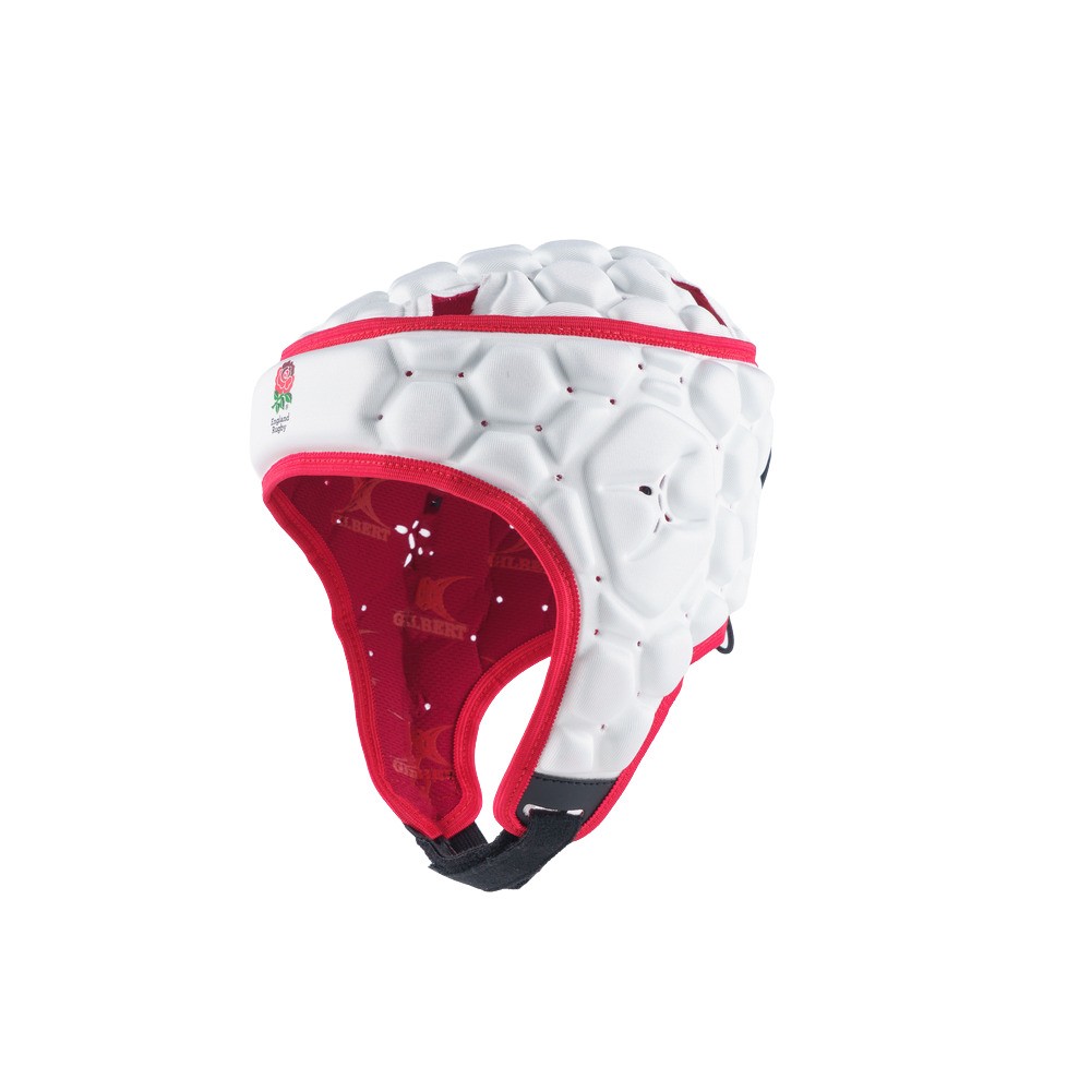 White padded rugby headguard with red accents, featuring hexagonal cushioning, adjustable chin strap, and England Rugby emblem on the front.