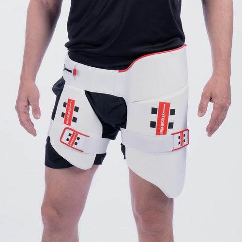 Gray-Nicolls All in One 360 cricket thigh pads in white, featuring adjustable straps, protective padding, and a sleek design for enhanced mobility and safety.