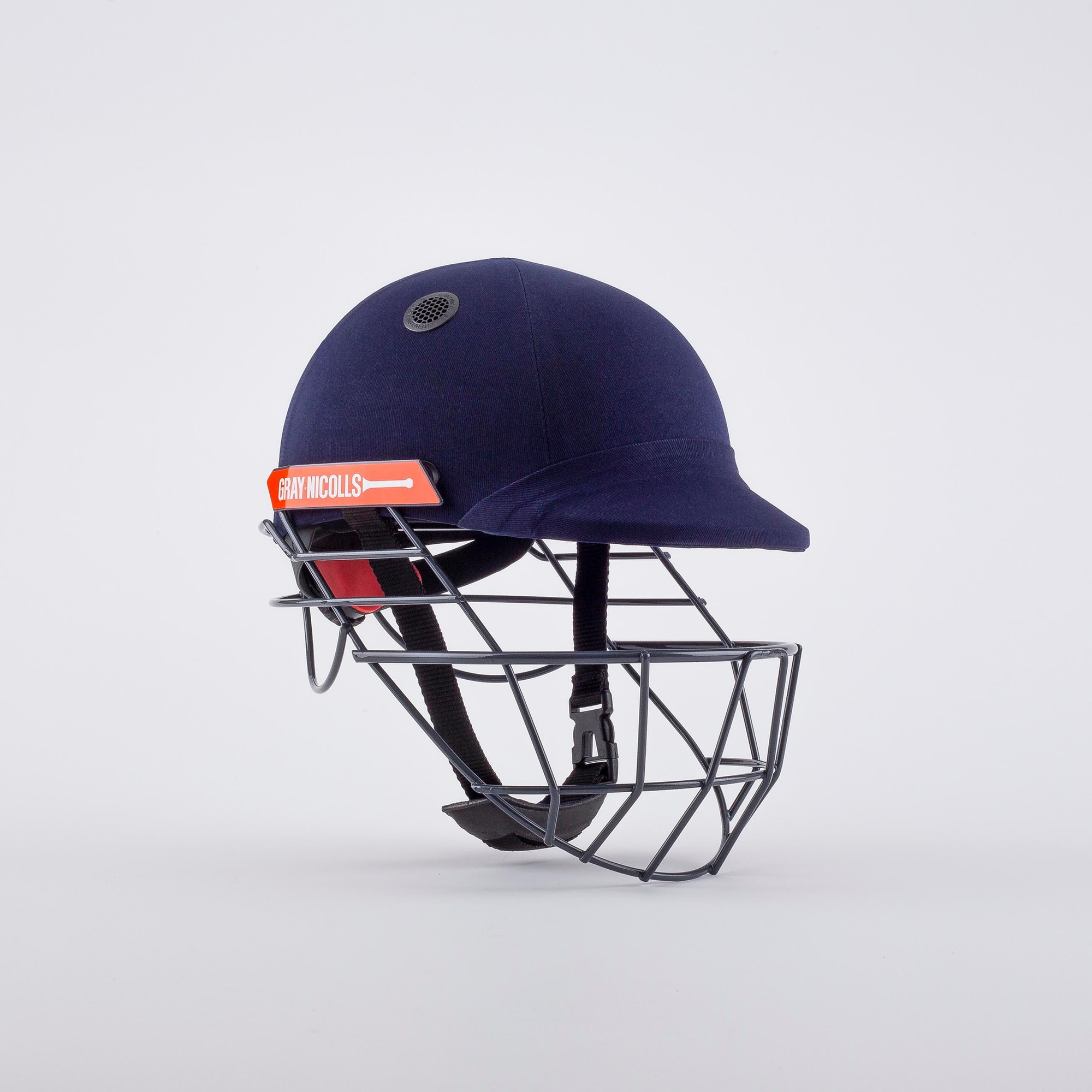 Gray-Nicolls Atomic 360 cricket helmet in navy blue with a black metal grill, featuring an adjustable chin strap and a bright orange logo on the front.