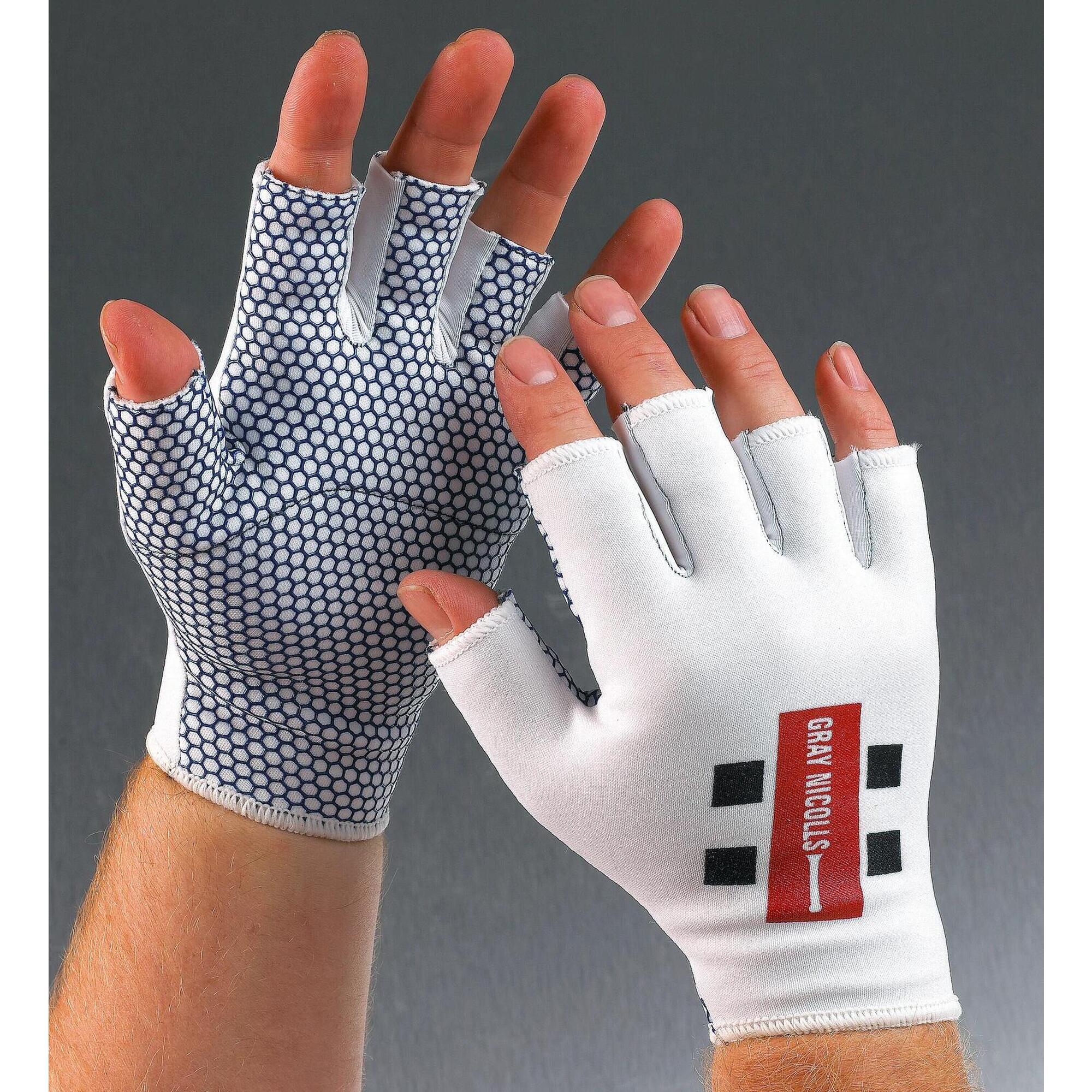 White Gray-Nicolls catching glove featuring a textured grip on the palms, fingerless design, and a prominent red and black logo on the back.