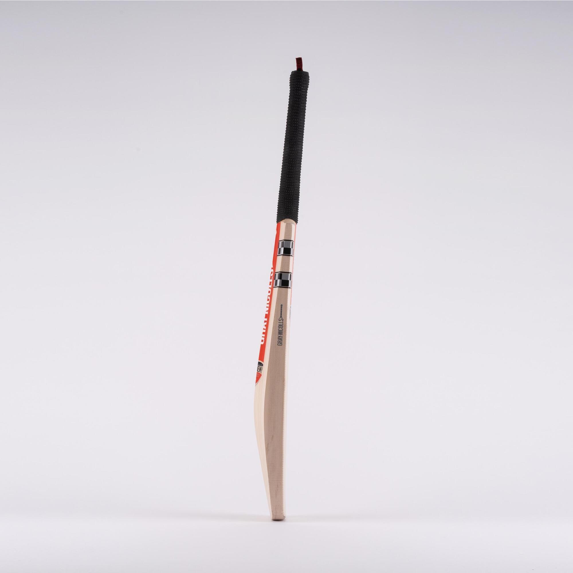 Gray-Nicolls Classic Academy Adult Cricket Bat in black and white, featuring a smooth wooden blade, a textured grip handle, and a sleek design for optimal performance.