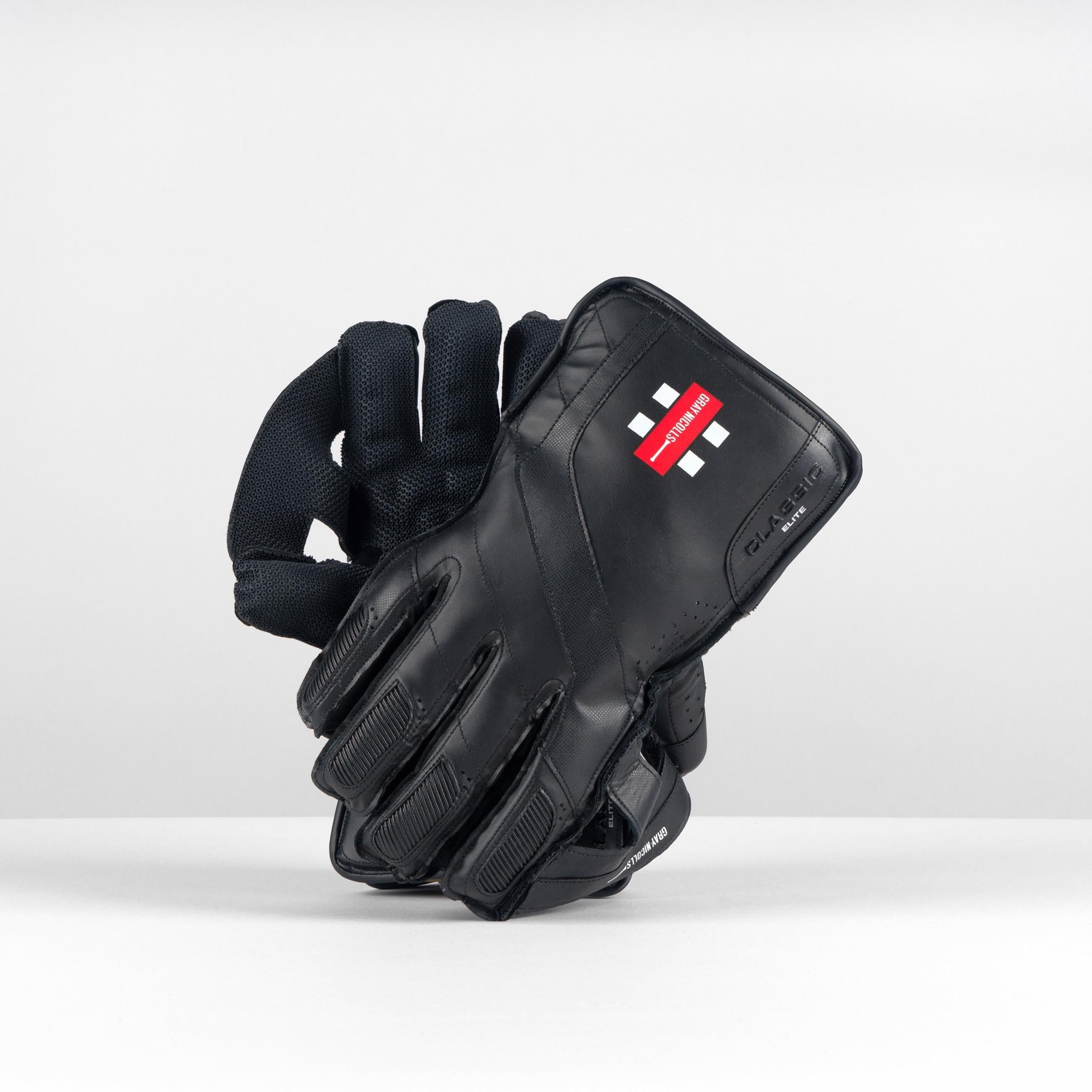 Gray-Nicolls Classic Elite Wicketkeeping Glove in white, featuring a sleek design, padded fingers, and a textured palm for grip, ideal for cricket players.