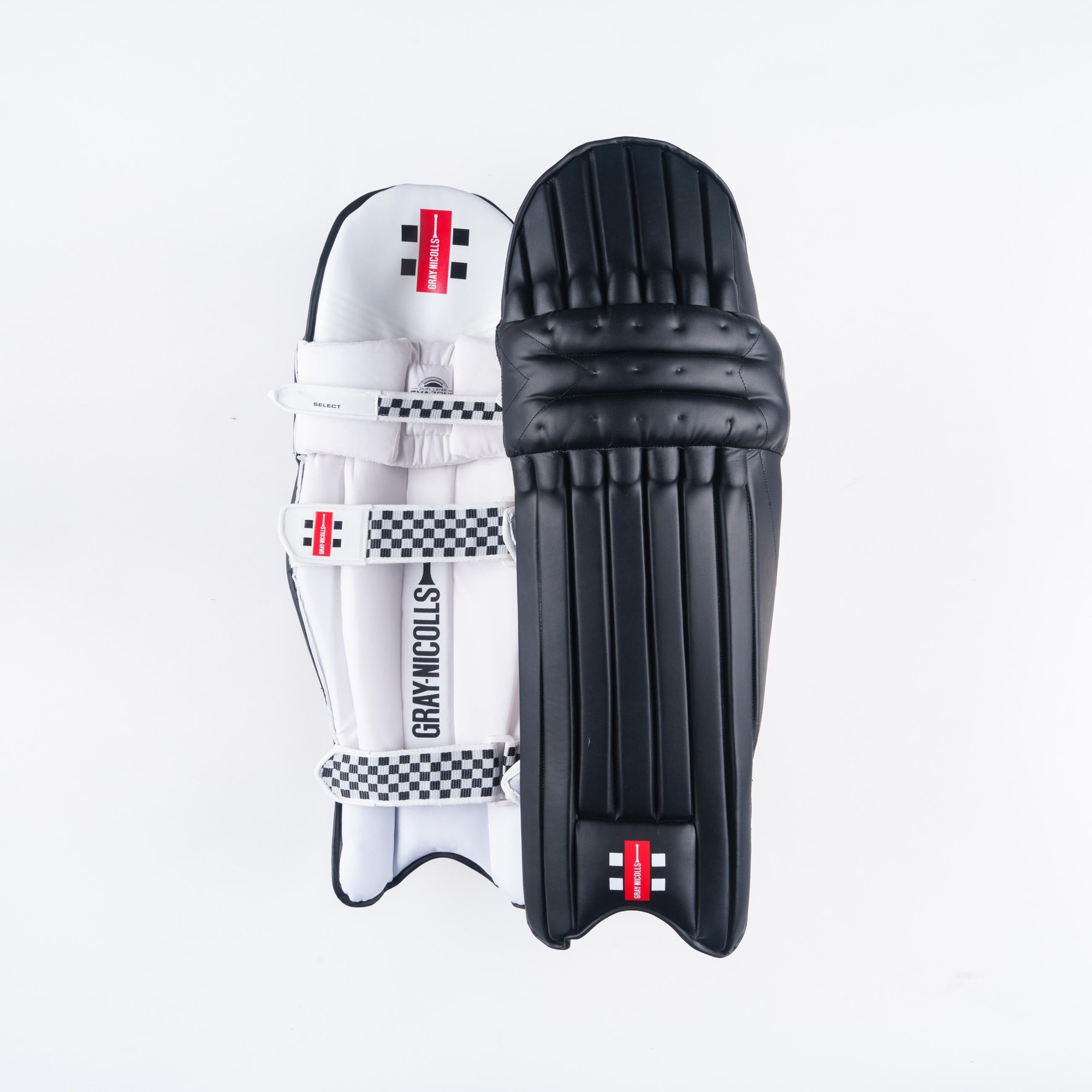 Gray-Nicolls Classic Select Batting Pads in multicolour, featuring a white and black design with padded protection, adjustable straps, and a checkered pattern on the sides.