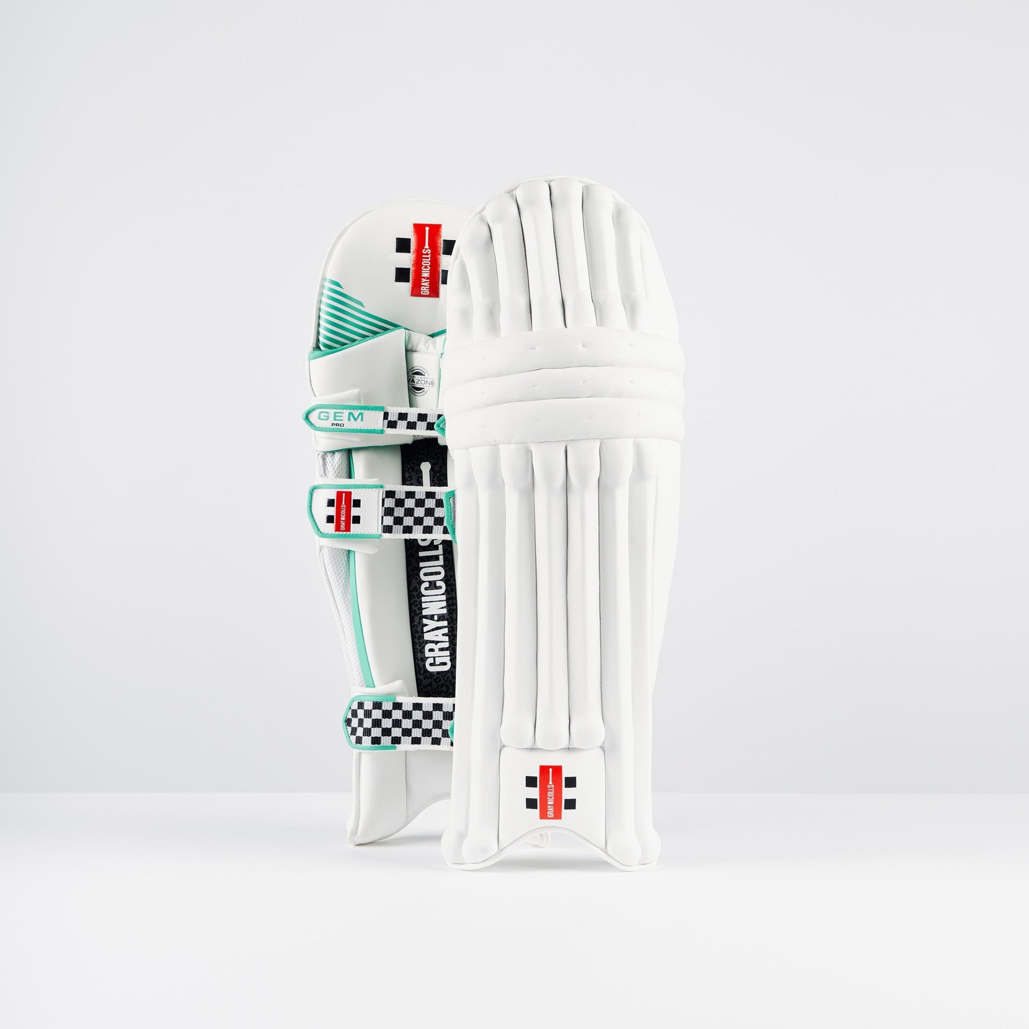 Gray-Nicolls GEM 3.0 Pro Batting Pads in white, featuring a sleek design with green accents, adjustable straps, and protective padding for enhanced performance.