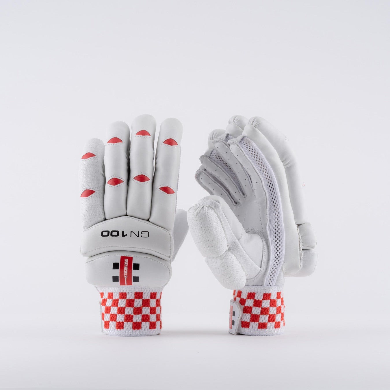 White Gray-Nicolls GN100 batting gloves featuring red accents, padded protection, a textured grip, and a checkered wrist strap for enhanced comfort and support.