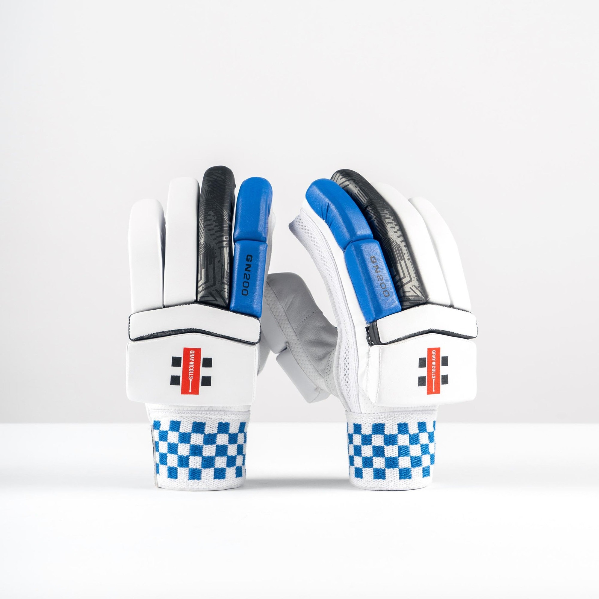 Gray-Nicolls GN200X junior batting gloves in white with blue and black accents, featuring a padded palm and checkered wrist design for enhanced grip and protection.