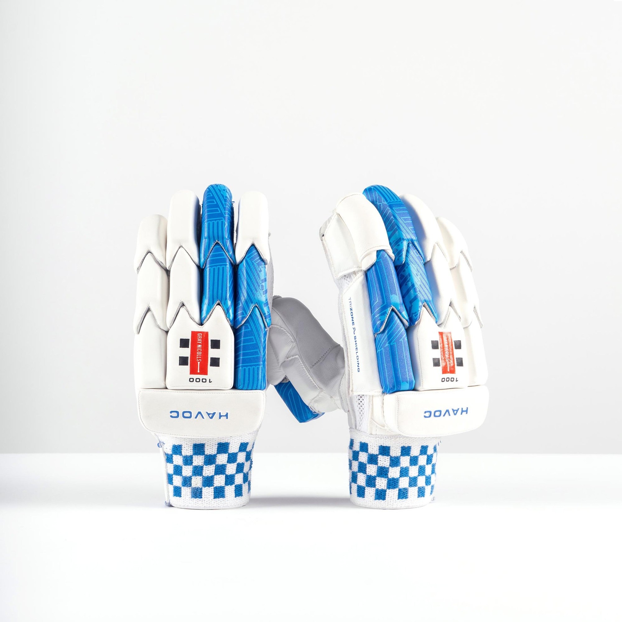 White Gray-Nicolls Havoc 1.0 1000 adult batting gloves featuring blue accents, a textured grip, and a checkered wrist design for enhanced support and comfort.