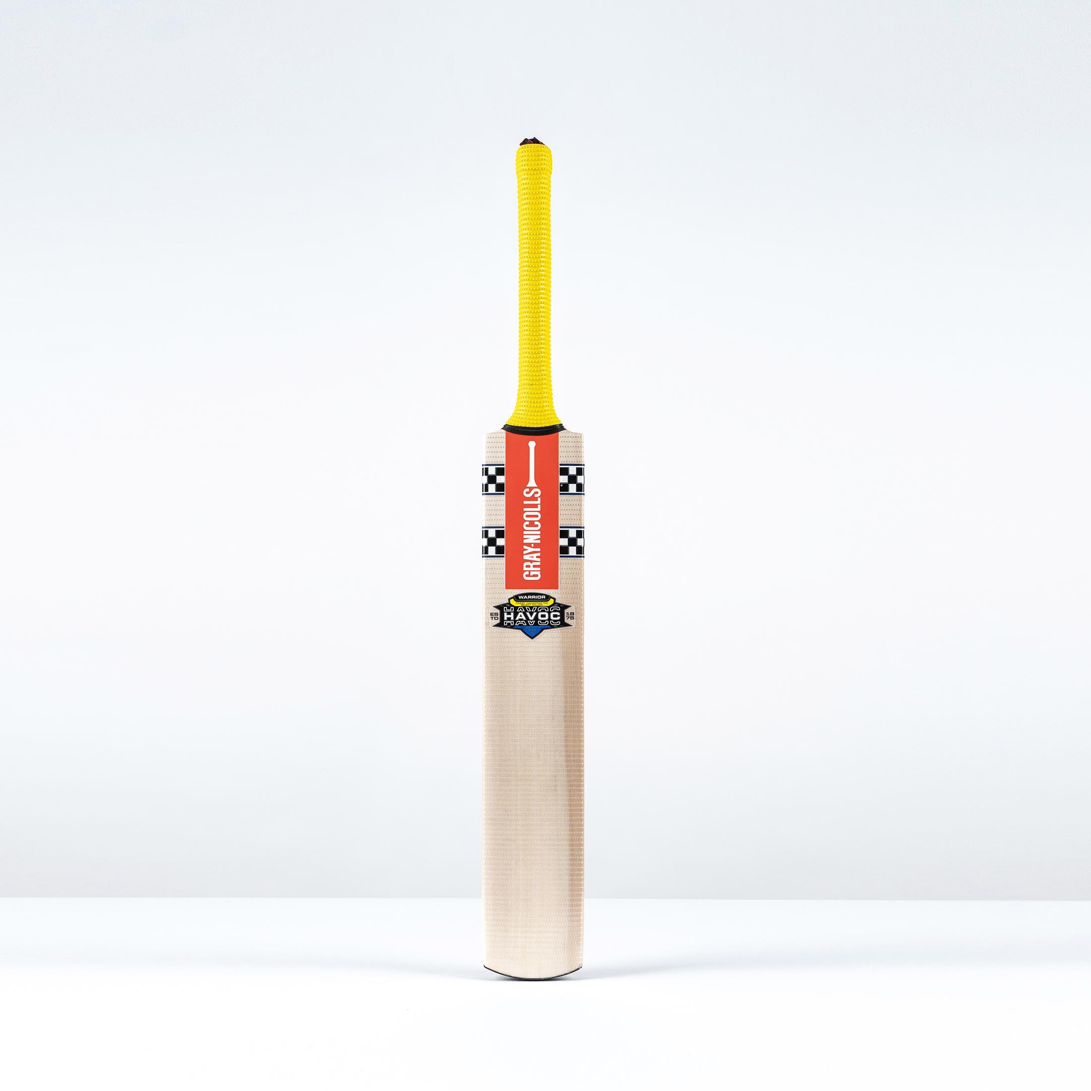 Gray-Nicolls Havoc HB317 Warrior Junior Cricket Bat featuring a light wood finish, yellow grip, and distinctive black and white checkerboard design on the handle.