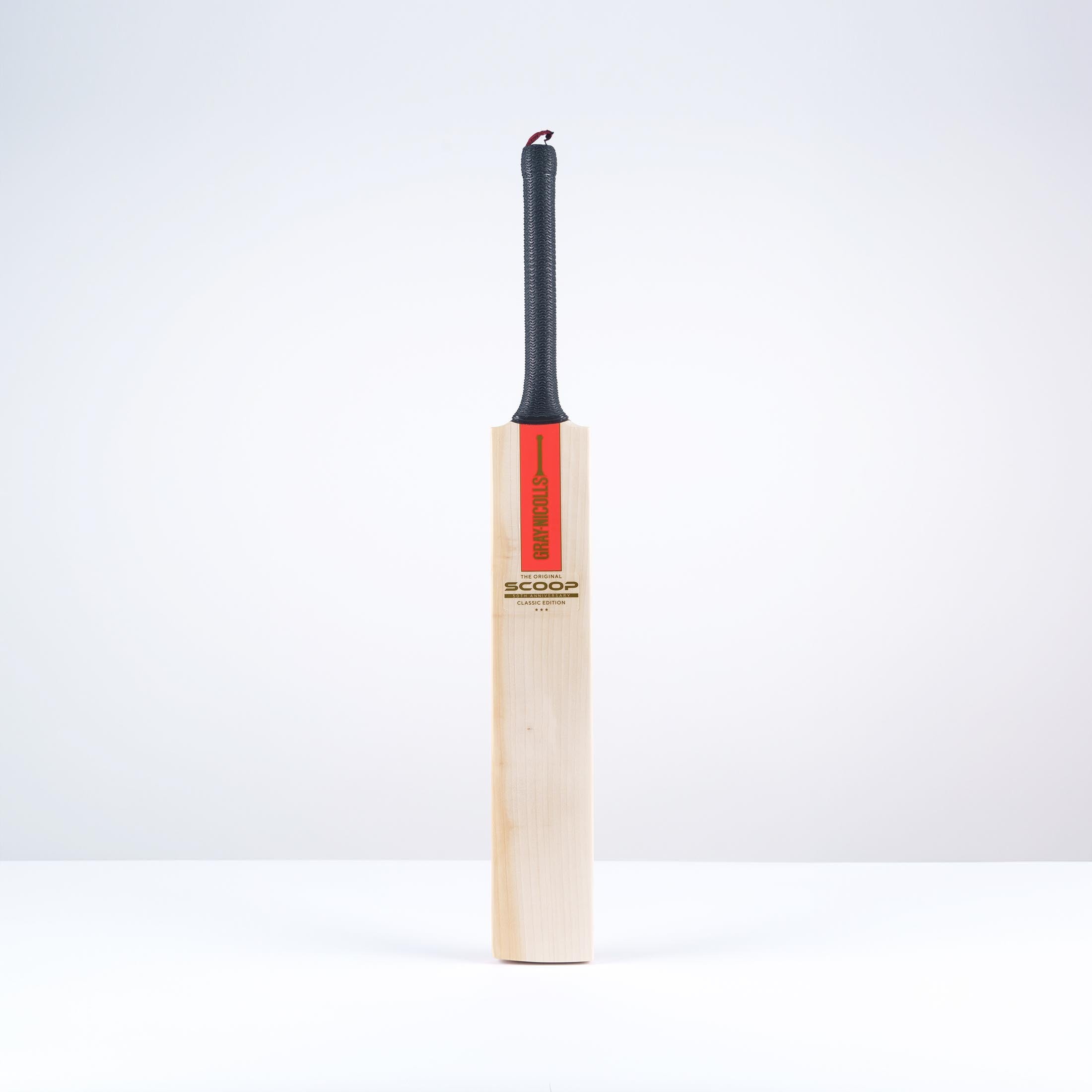 Gray-Nicolls Scoop 50 Classic Edition cricket bat featuring a smooth wooden blade, red branding, and a black rubber grip on the handle, designed for adult players.