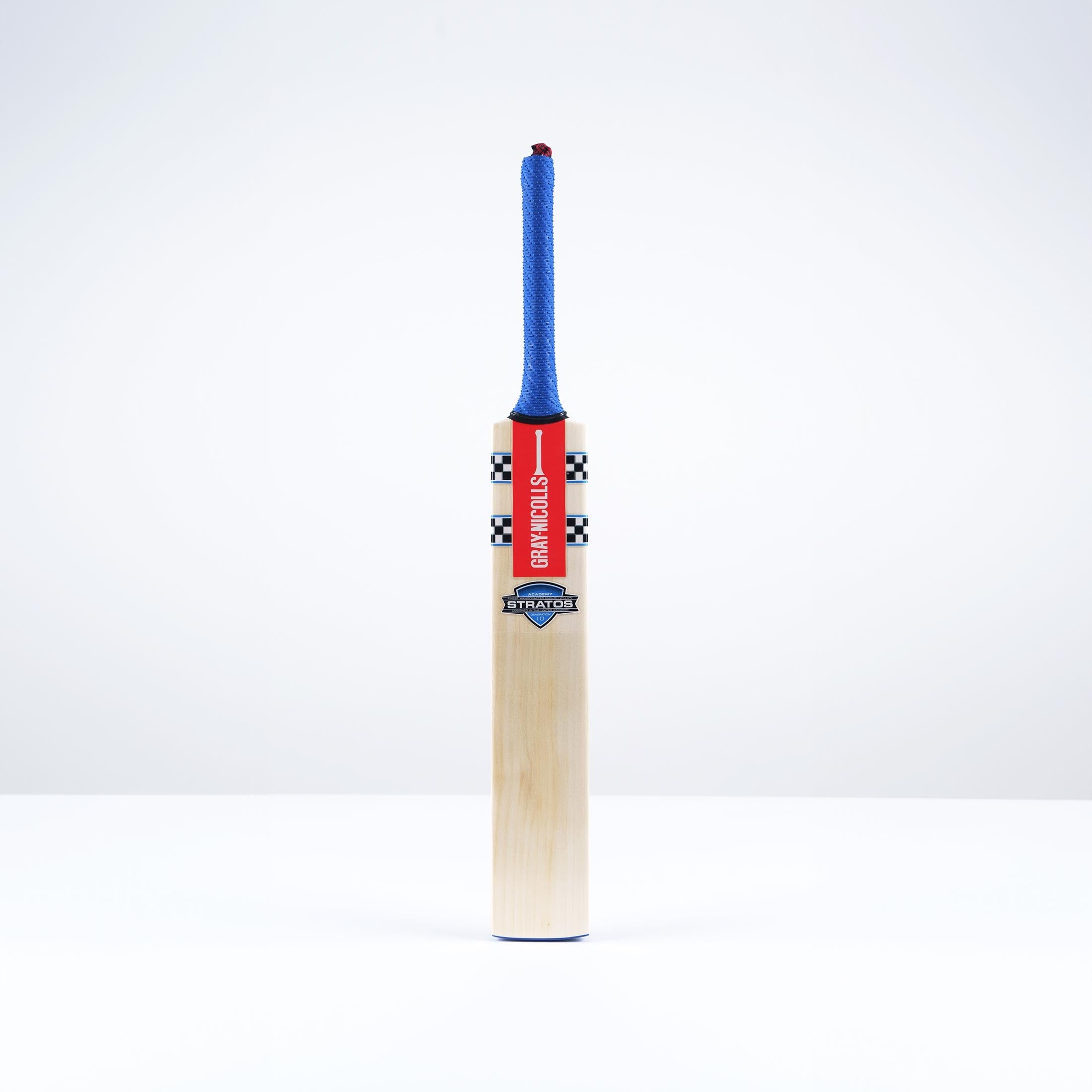 Gray-Nicolls Stratos 1.0 Academy Junior Cricket Bat featuring a light wooden blade, red and black branding, and a blue rubber grip on the handle.