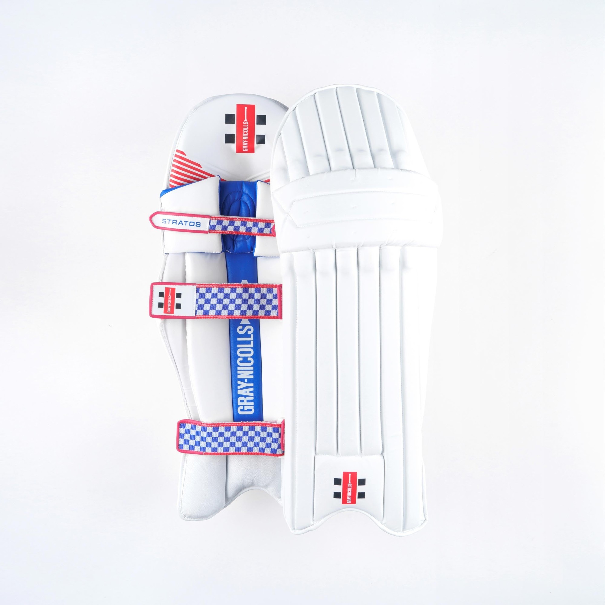 Gray-Nicolls Stratos 1.0 batting pads in white, featuring a sleek design with blue and red accents, adjustable straps, and a padded surface for protection.