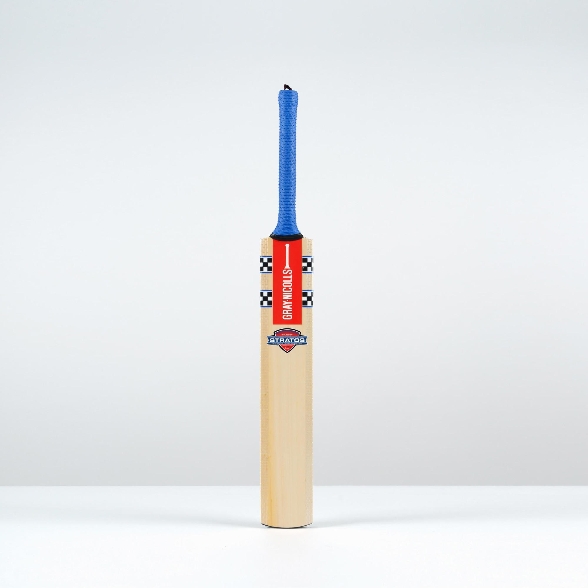 Gray-Nicolls Stratos 1.0 Thunder Junior Cricket Bat featuring a wooden body, red and blue grip, and distinctive branding on the handle.