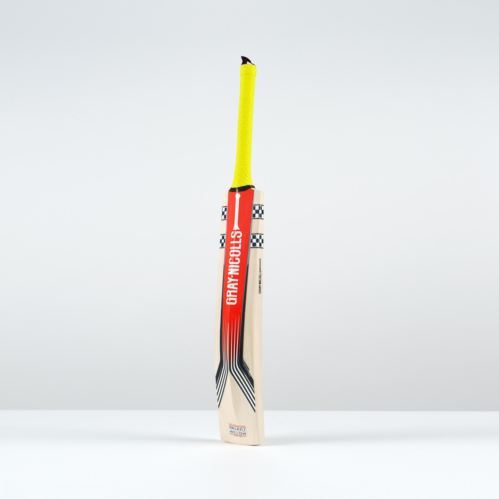 Gray-Nicolls Stratos 1.1 5 Star Lite cricket bat for juniors, featuring a black and red design, lightweight wood, and a bright yellow grip.