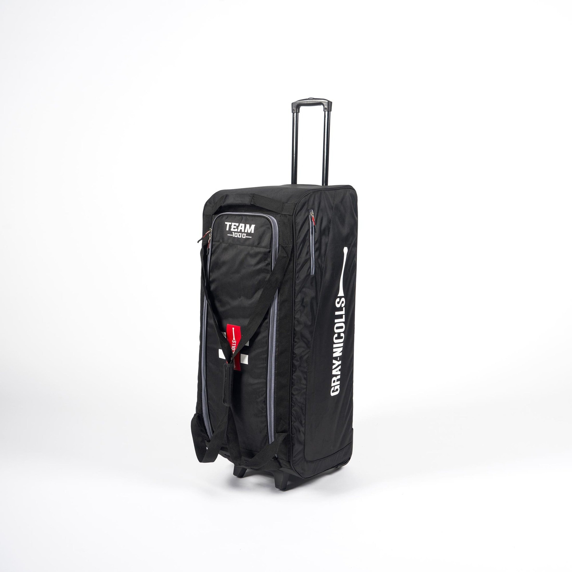 Gray-Nicolls Team 1000 Wheelie Bag in black, featuring durable material, a retractable handle, and red accents, designed for easy transport of sports gear.