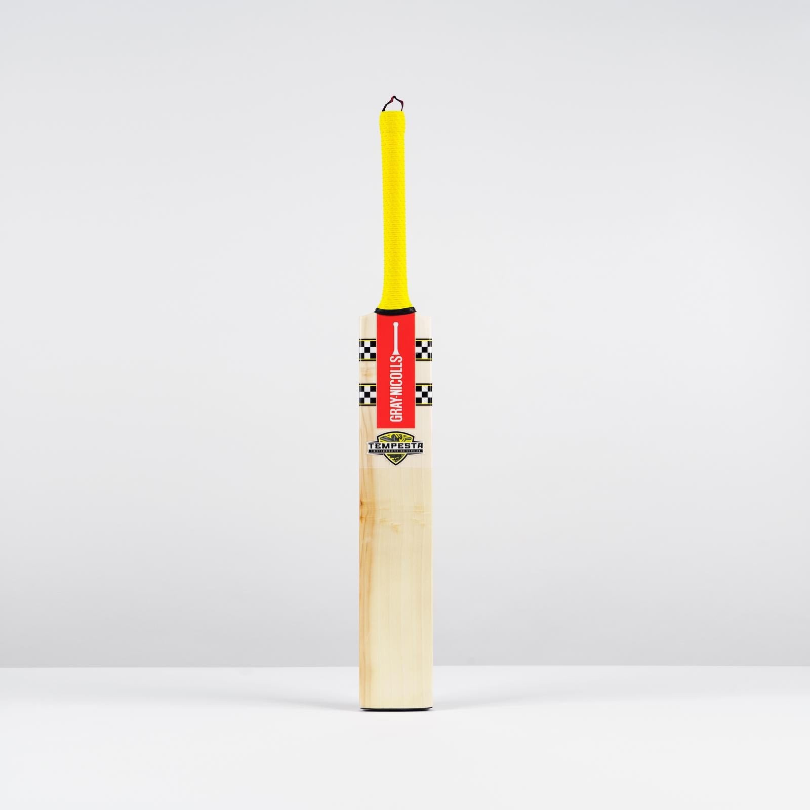Gray-Nicolls Tempesta 1.4 300 adult cricket bat featuring a light wooden blade, vibrant red and yellow grip, and distinctive checkered design near the handle.