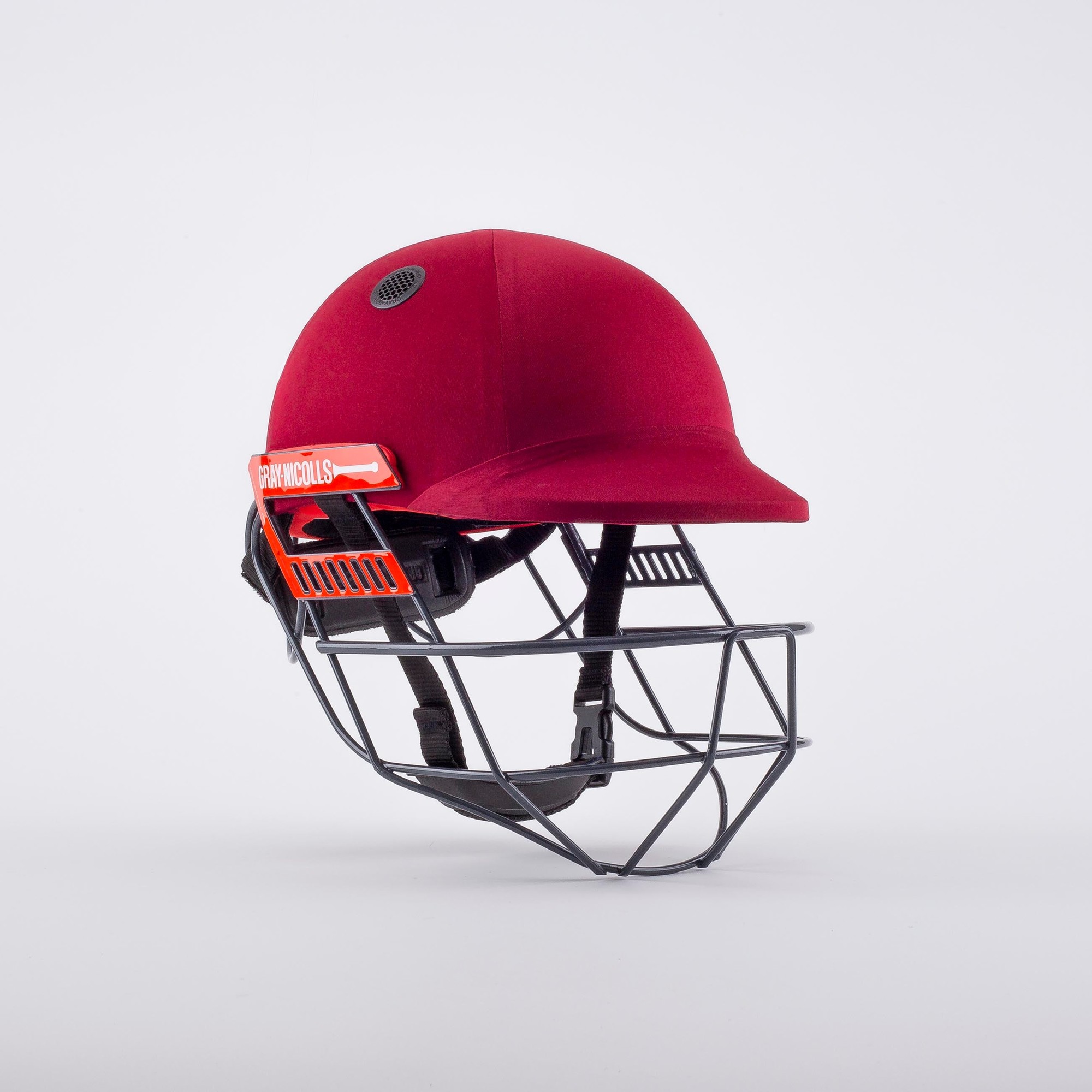 Gray-Nicolls Ultimate 360 Junior cricket helmet in maroon with a black grille, featuring ventilation holes and a padded interior for enhanced protection and comfort.