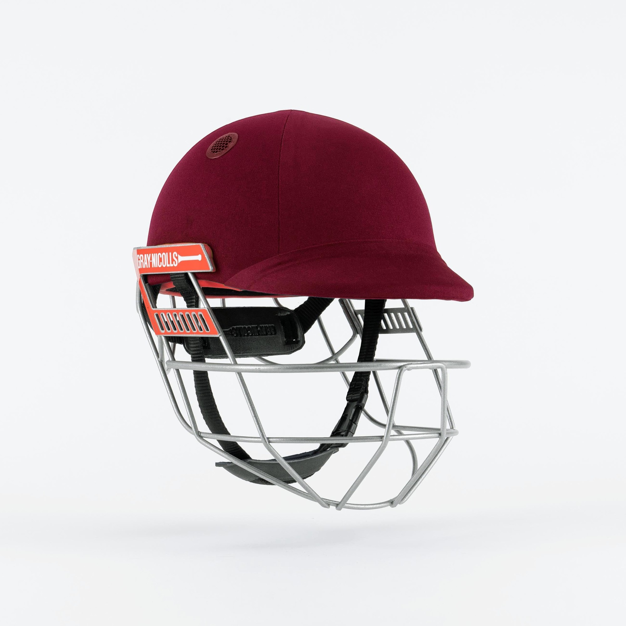 Gray-Nicolls Ultimate 360 Pro Cricket Helmet in maroon with a metal grill, featuring a padded interior for safety and ventilation holes for comfort during play.