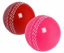 White Gray-Nicolls Velocity cricket ball featuring a smooth, glossy surface and distinctive seam stitching for enhanced grip and performance.