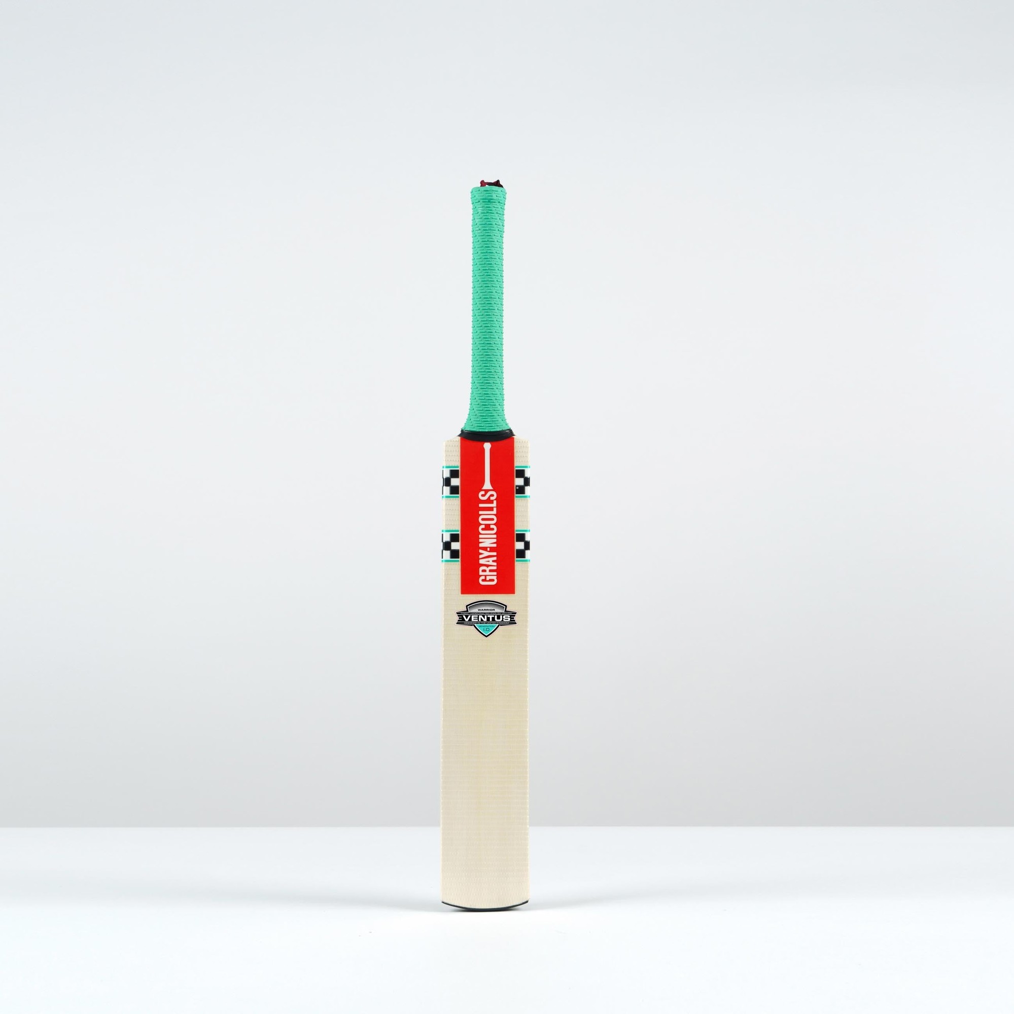 Gray-Nicolls Ventus 1.0 Warrior Junior Cricket Bat featuring a light wooden blade, green rubber grip, and vibrant red and black branding.