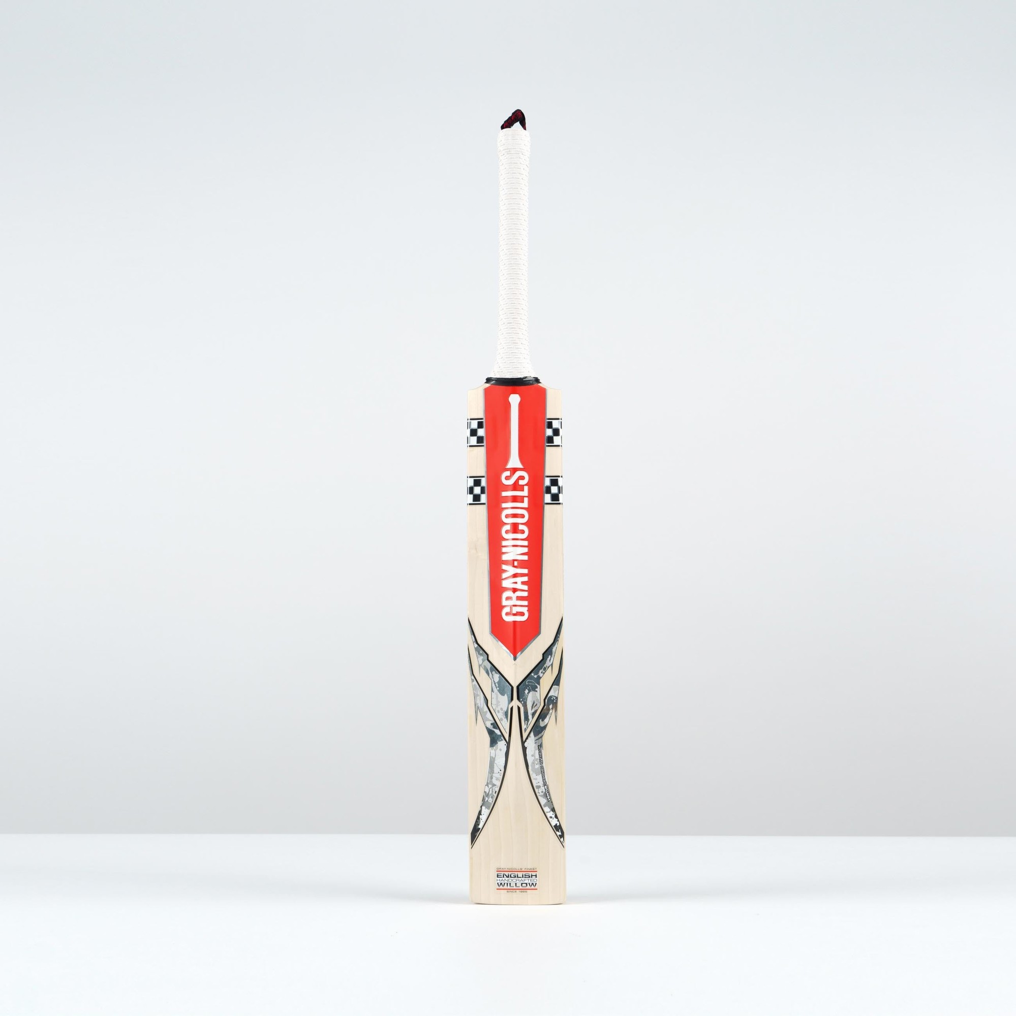Gray-Nicolls Ventus 1.1 300 Junior Cricket Bat featuring a light wooden body, red and black branding, and a textured white grip on the handle.