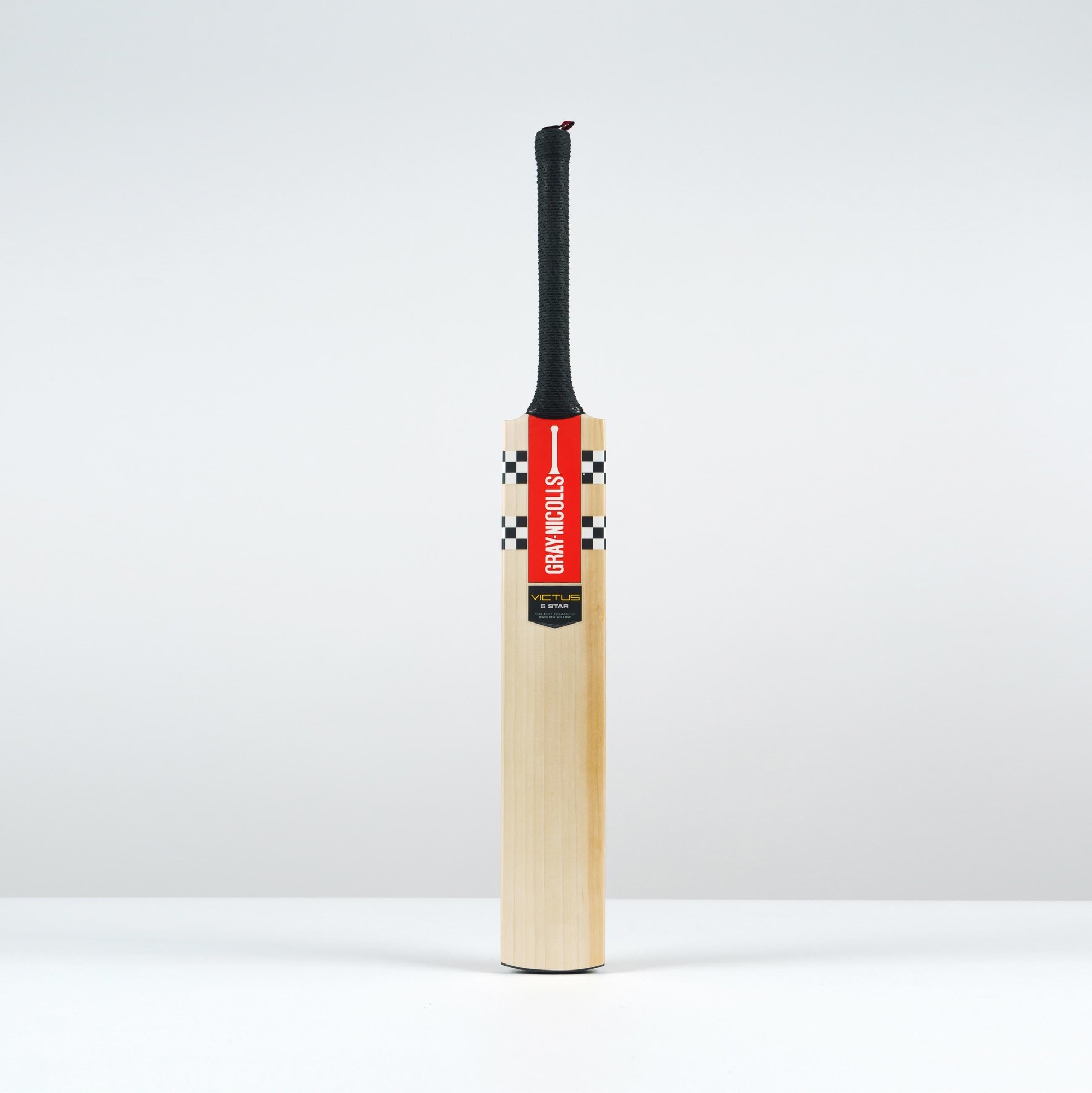 Gray-Nicolls Victus 5 Star Cricket Bat featuring a smooth wooden blade, black rubber grip, and a prominent red and black label with brand details.