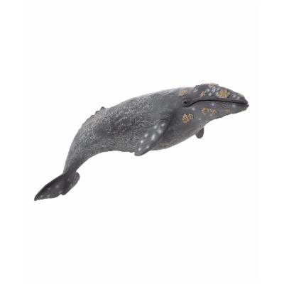 Large grey whale figurine featuring realistic detailing, textured skin, and a slightly glossy finish, showcasing shades of grey with hints of white and brown markings.