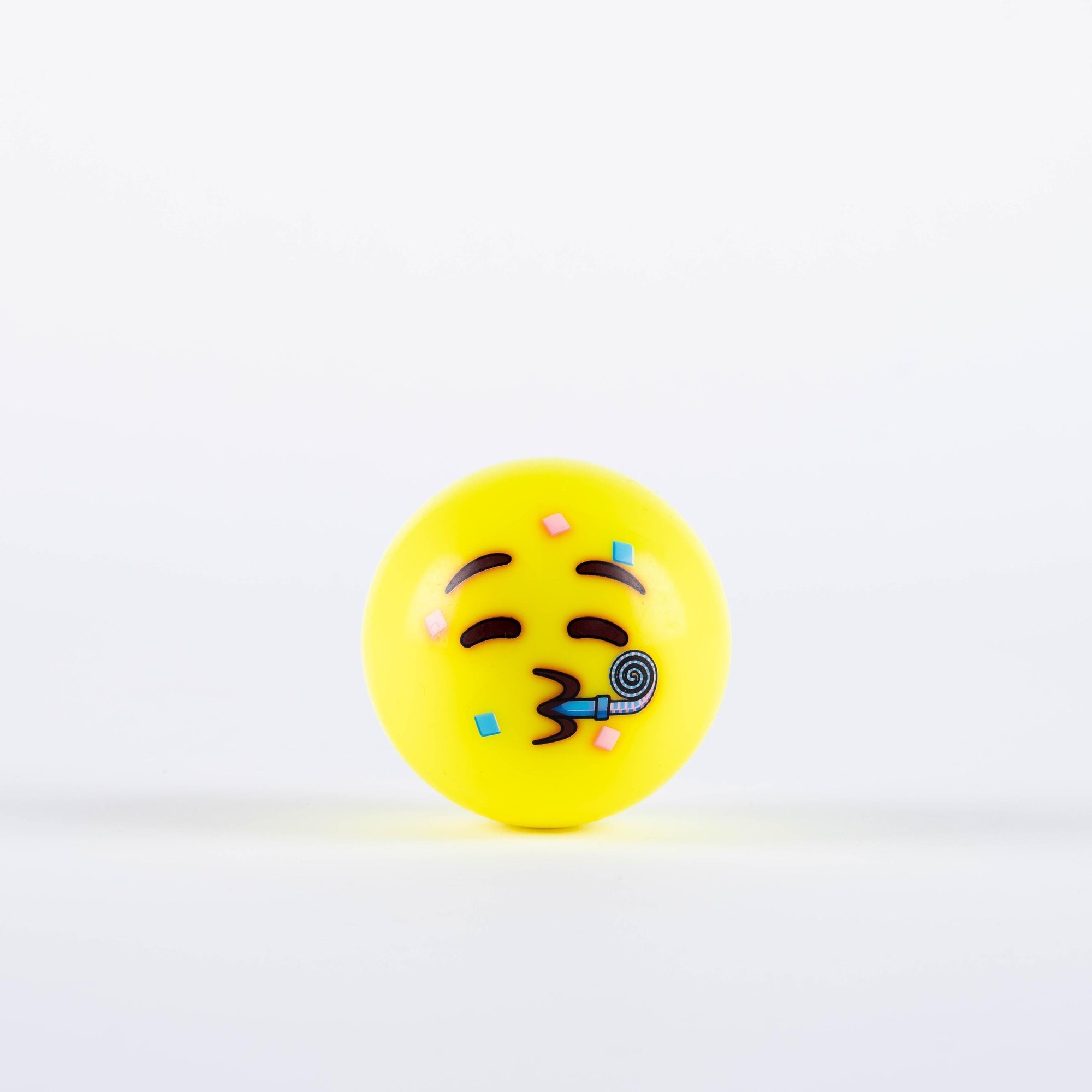 Fluo yellow hockey ball featuring a playful emoji design with a smiling face, colorful confetti, and a party horn, made from durable material for vibrant visibility.