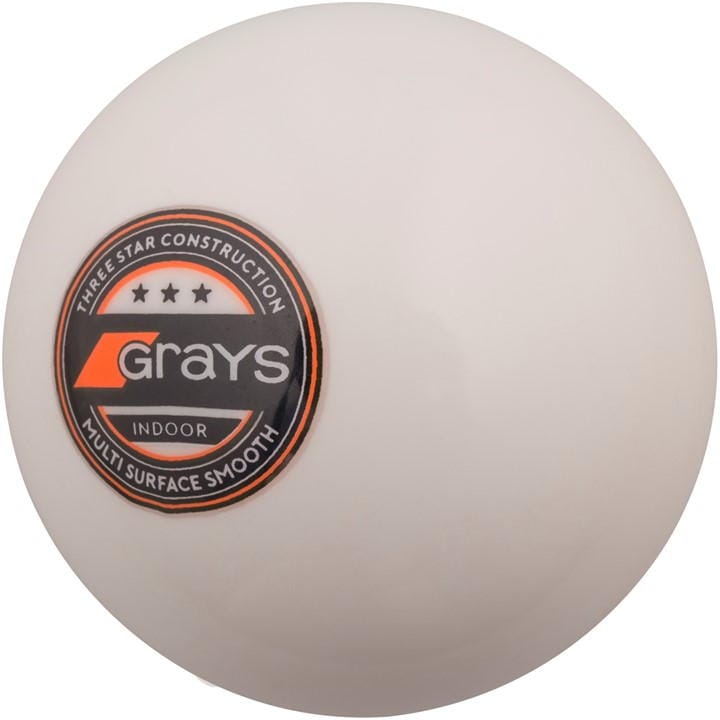 White indoor hockey ball featuring a smooth surface, marked with a black and orange Grays logo and "Three Star Construction" text.