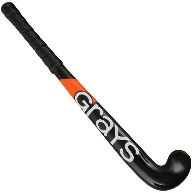 Black hockey stick with an orange accent, featuring a textured grip handle and the "Grays" logo prominently displayed in white along the shaft.