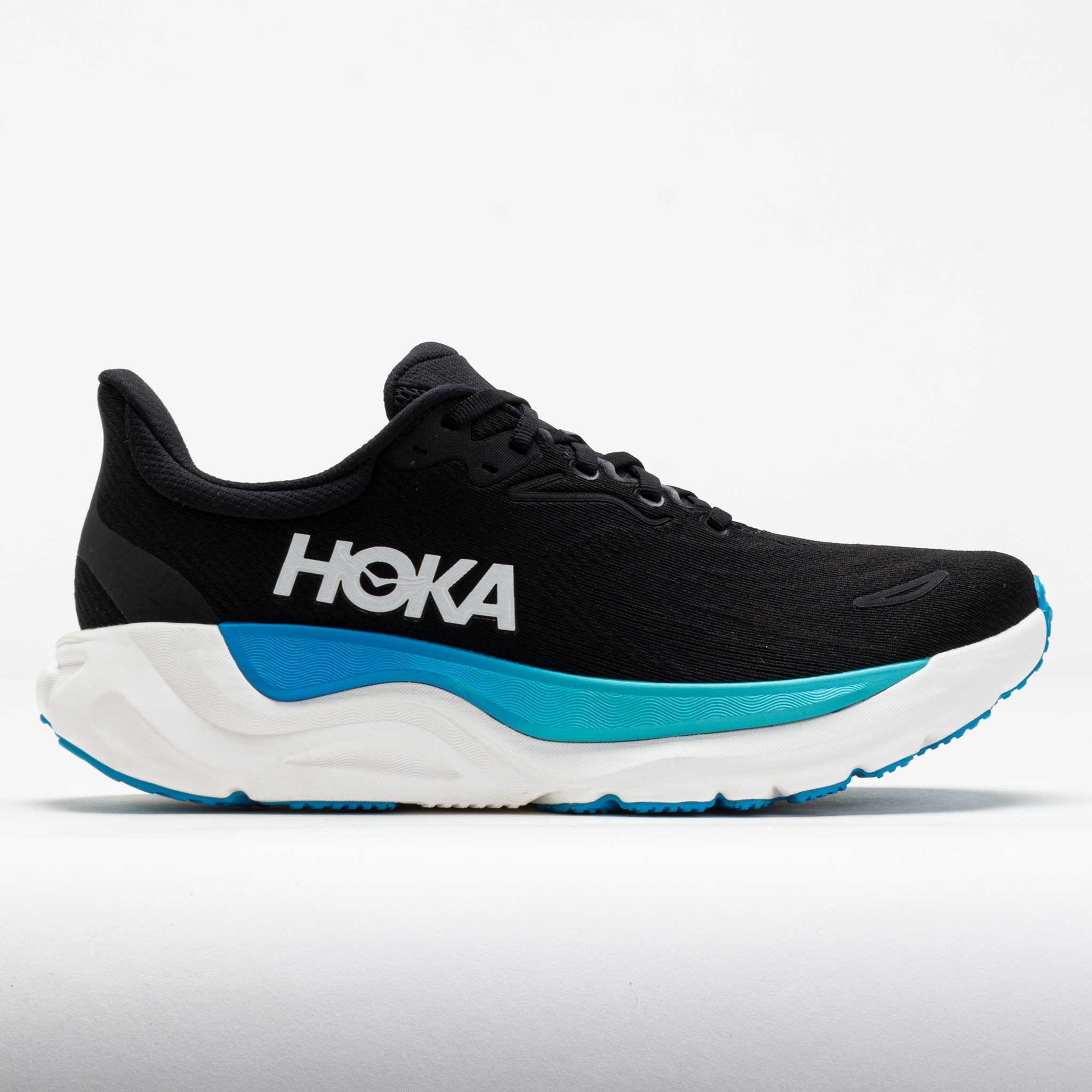 Men's HOKA Arahi 8 running shoes in black with skyward blue accents, featuring a lightweight mesh upper, cushioned midsole, and prominent HOKA logo on the side.