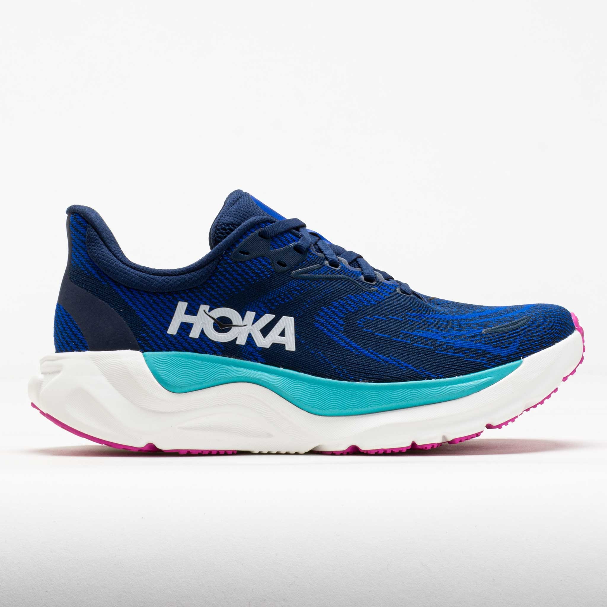 Navy blue HOKA Arahi 8 women's running shoe featuring a breathable mesh upper, cushioned midsole, and pink and teal accents on the sole.