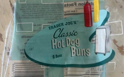 Classic Hot Dog Buns packaging in turquoise with a playful design, featuring ketchup and mustard bottles, labeled "Trader Joe's Classic Hot Dog Buns," containing six buns.