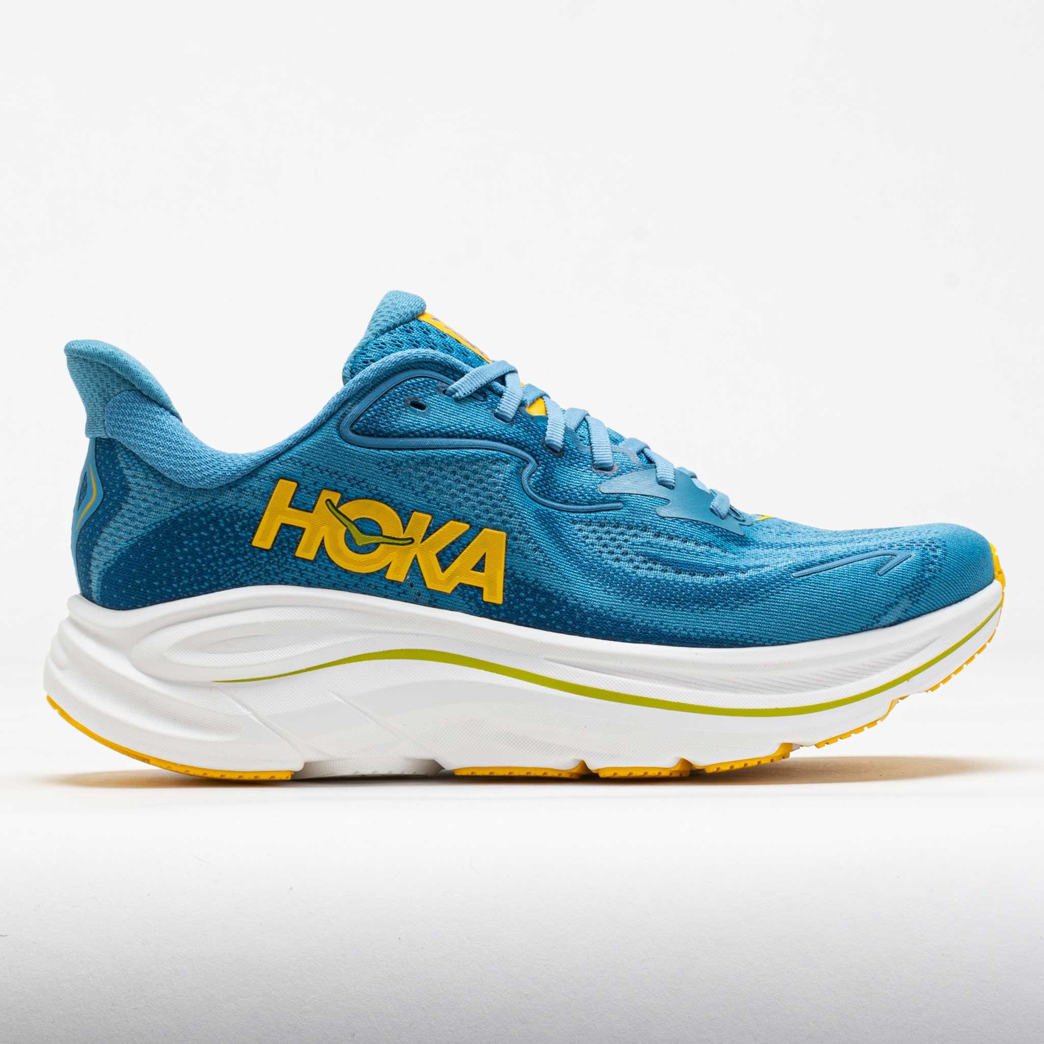 HOKA Men's Clifton 10 road running shoes in Alpine Blue and Foggy Night, featuring a breathable mesh upper, cushioned sole, and vibrant yellow logo, size 10.5 W.