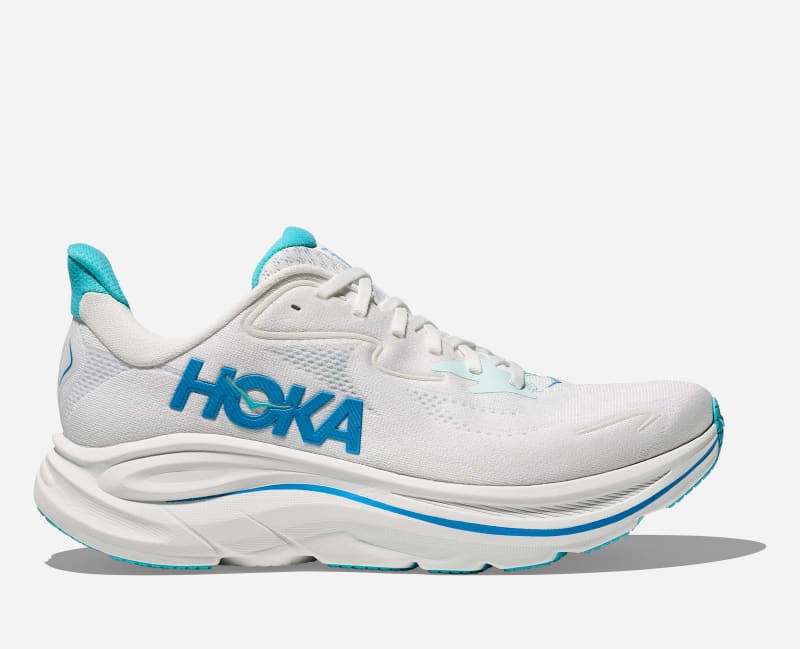 HOKA Men's Clifton 10 shoes in white and skyward blue, featuring a lightweight mesh upper, cushioned sole, and prominent HOKA branding on the side. Size 7.5.