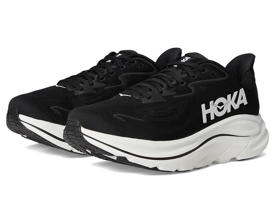 HOKA Women's Clifton 10 road running shoes in black and white, featuring a lightweight mesh upper, cushioned sole, and prominent HOKA branding on the side, size 2.